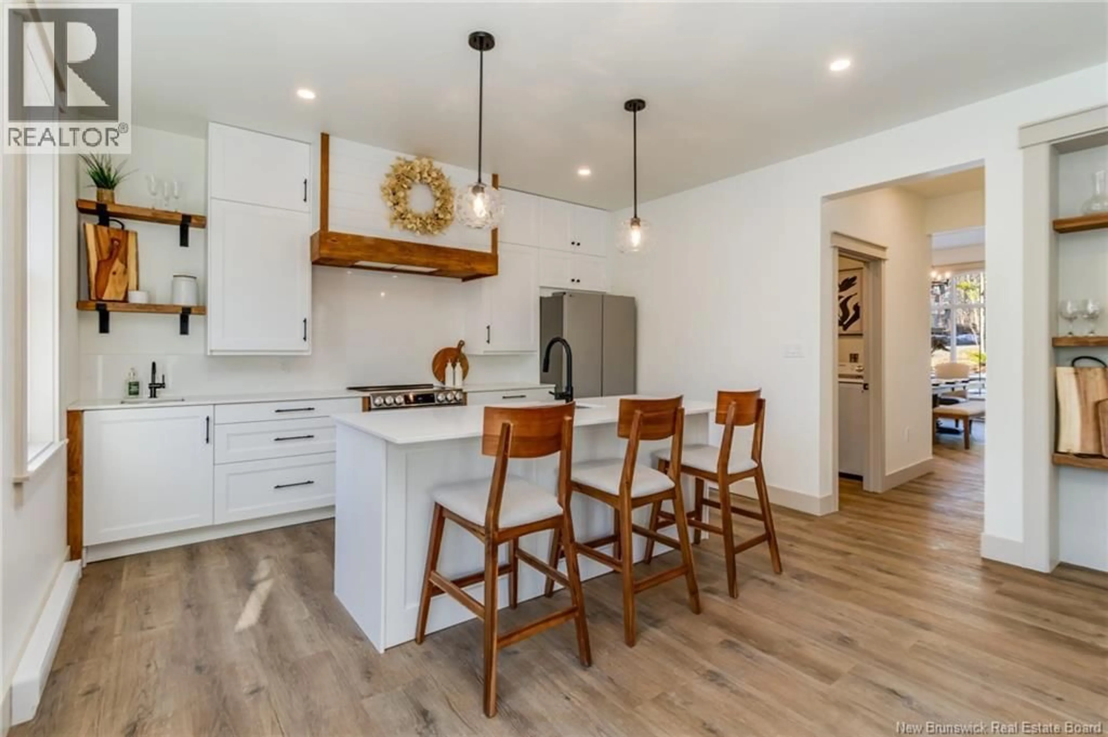 Open concept kitchen, wood/laminate floor for 87 CHATEAU DRIVE, McLeod Hill New Brunswick E3G5X6