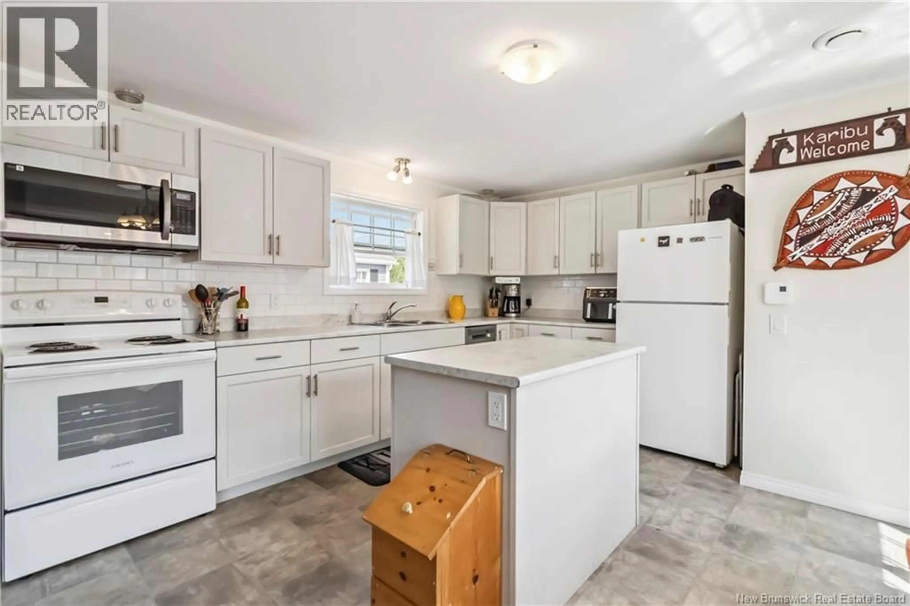 Open concept kitchen, ceramic/tile floor for 65 ULYSSE DRIVE, Dieppe New Brunswick E1A7C2