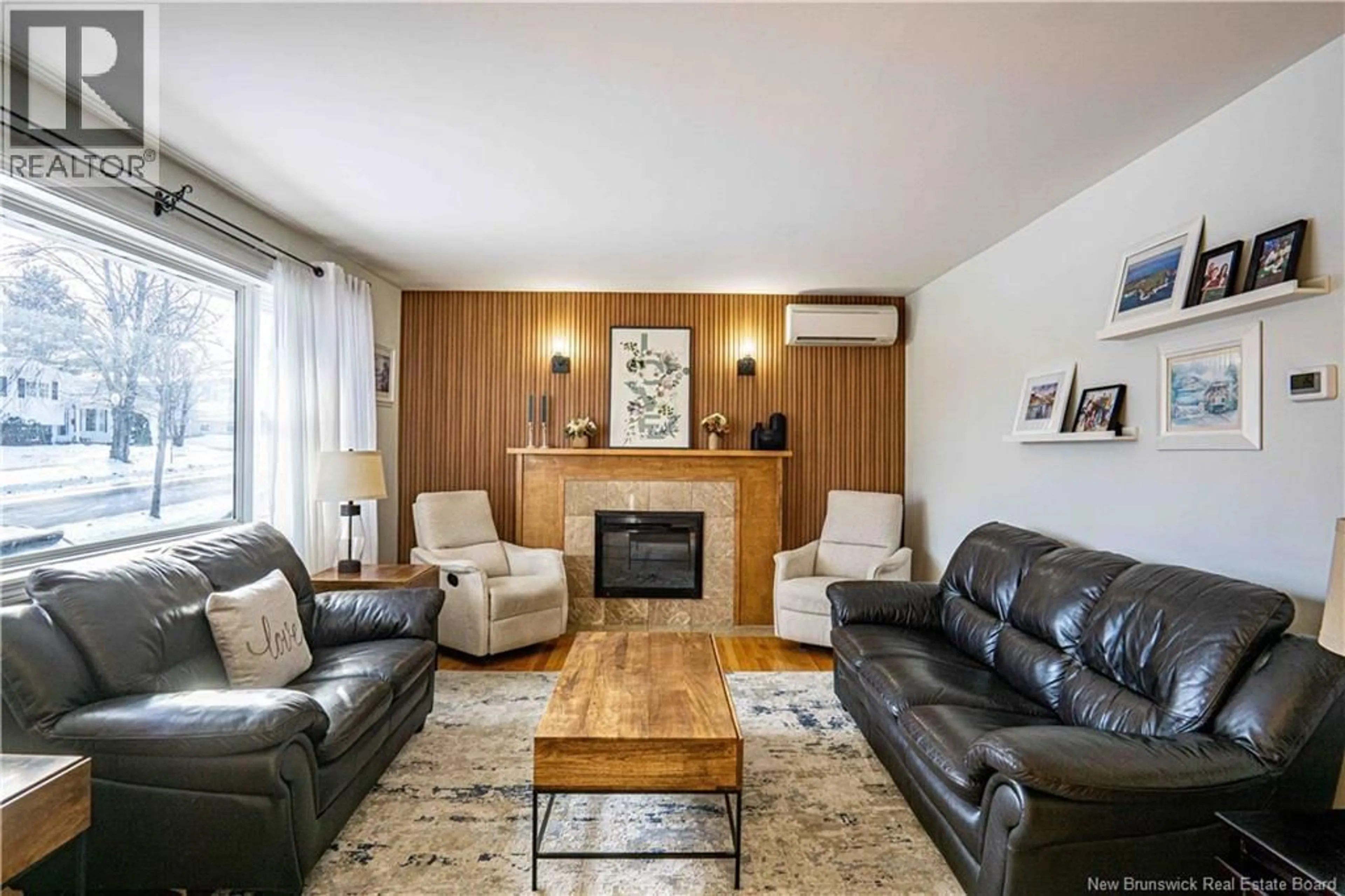 Living room with furniture, wood/laminate floor for 1011 YORK, Fredericton New Brunswick E3B3S4