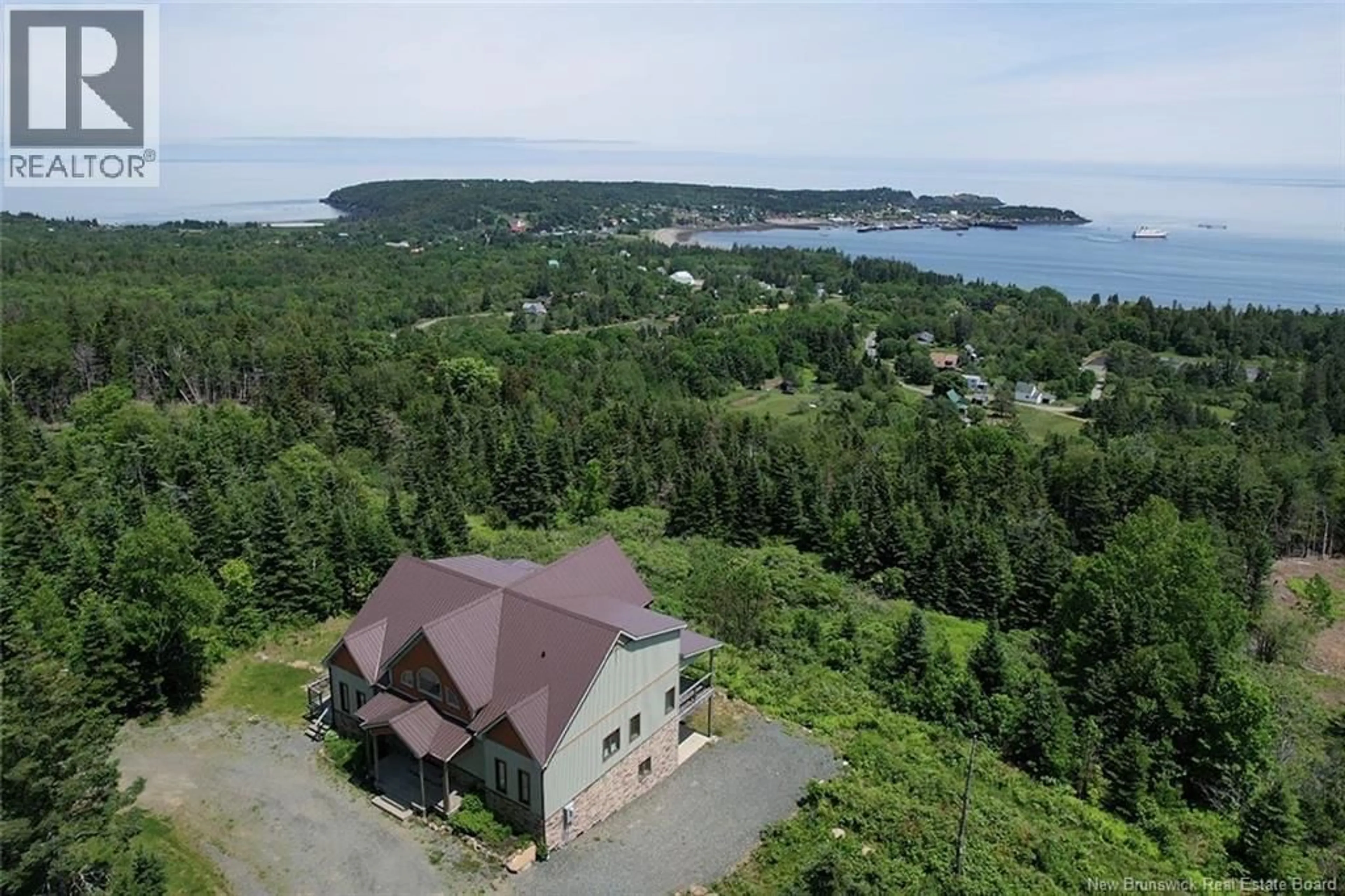 A pic from outside/outdoor area/front of a property/back of a property/a pic from drone, water/lake/river/ocean view for 60 OHIO POND ROAD, Grand Manan New Brunswick E5G4B4