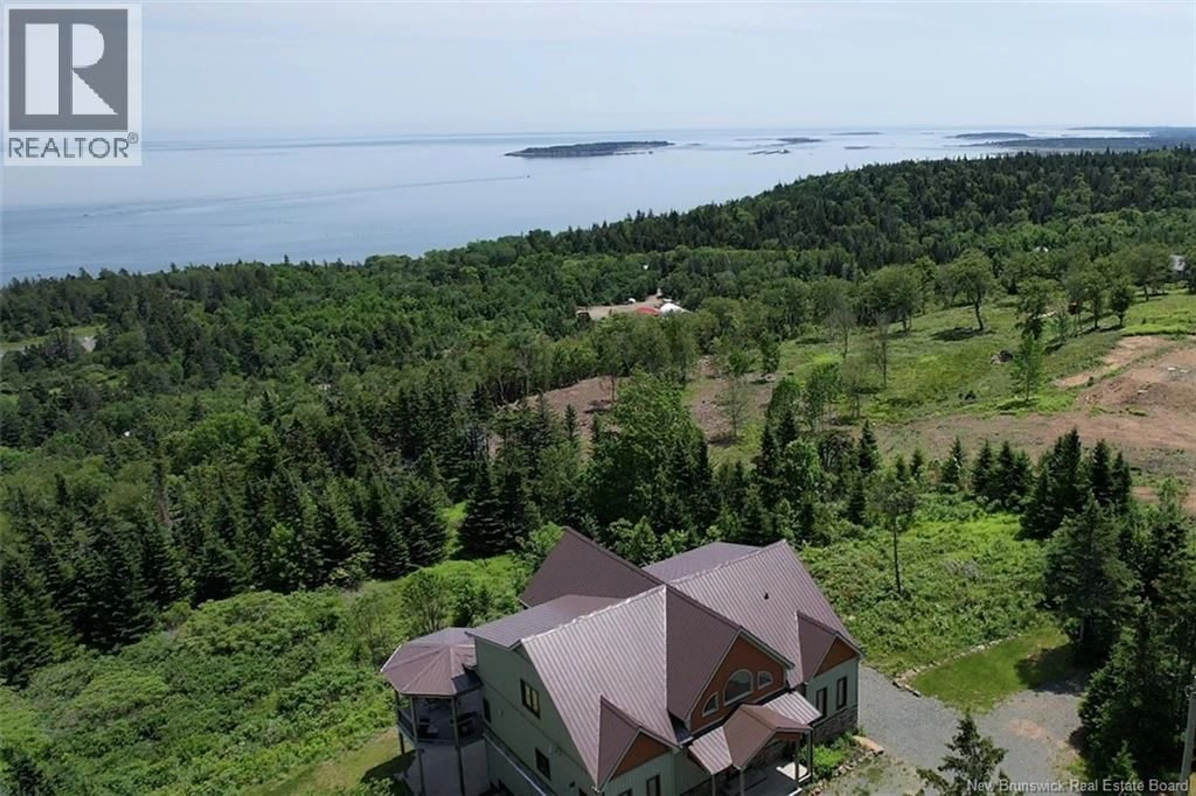 A pic from outside/outdoor area/front of a property/back of a property/a pic from drone, water/lake/river/ocean view for 60 OHIO POND ROAD, Grand Manan New Brunswick E5G4B4
