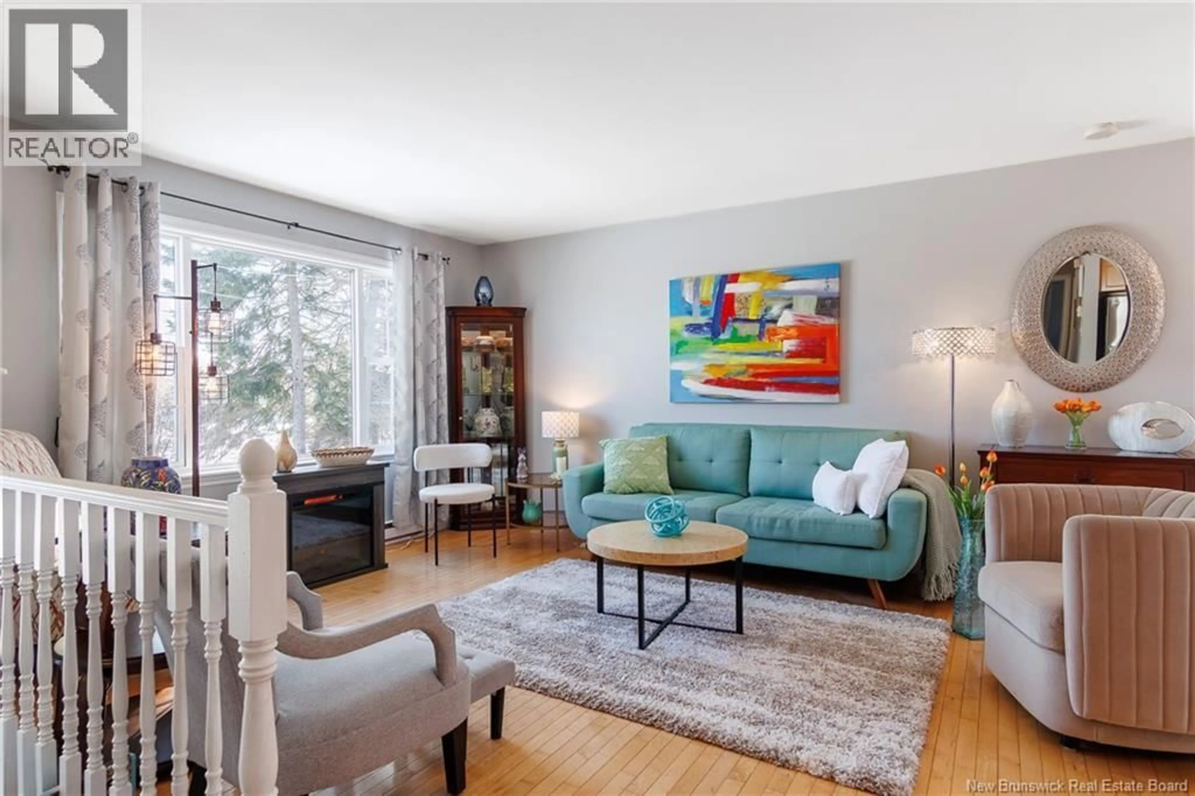 Living room with furniture, wood/laminate floor for 157 GONDOLA BOULEVARD, Quispamsis New Brunswick E2E1J3