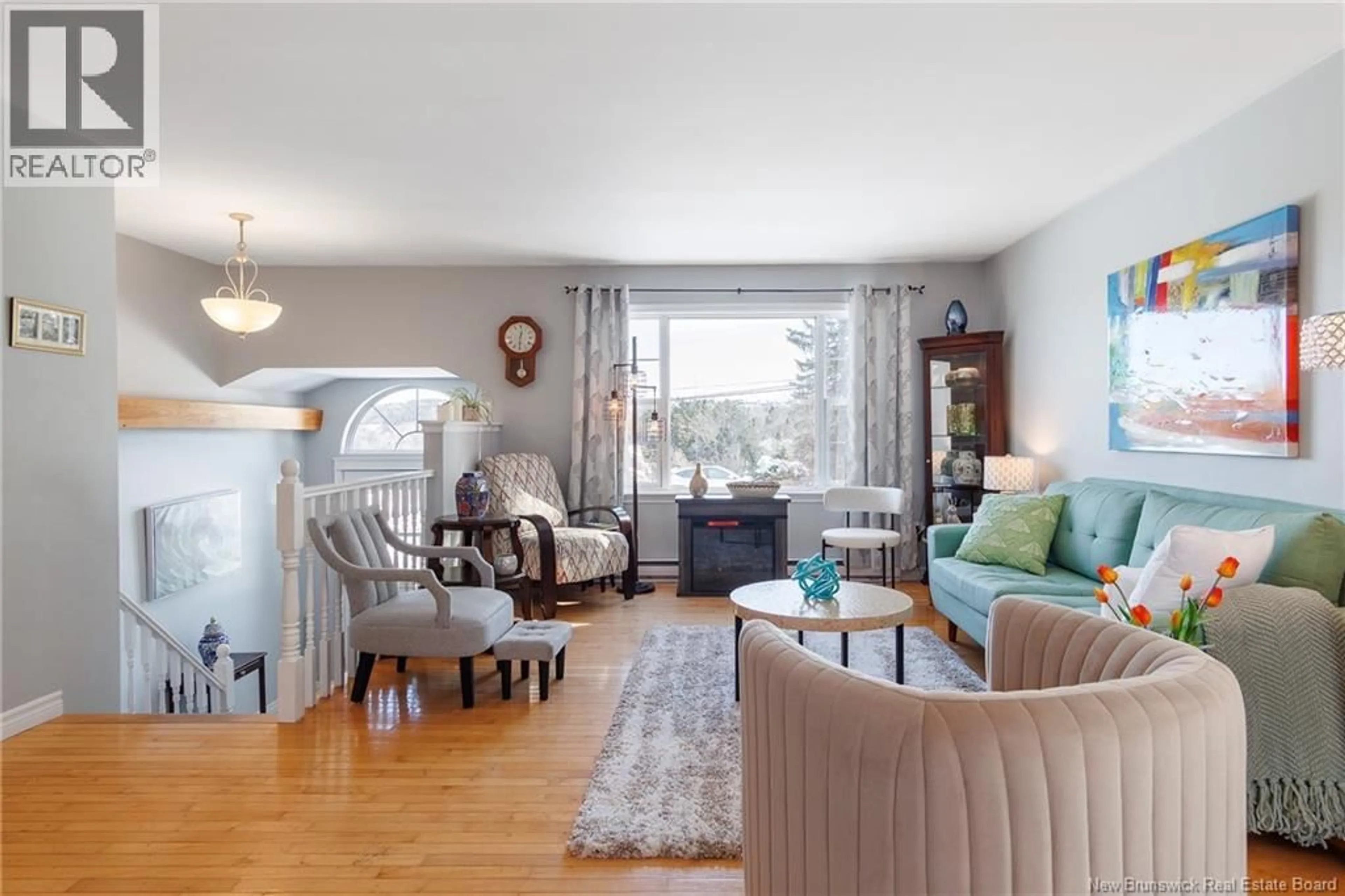Living room with furniture, wood/laminate floor for 157 GONDOLA BOULEVARD, Quispamsis New Brunswick E2E1J3