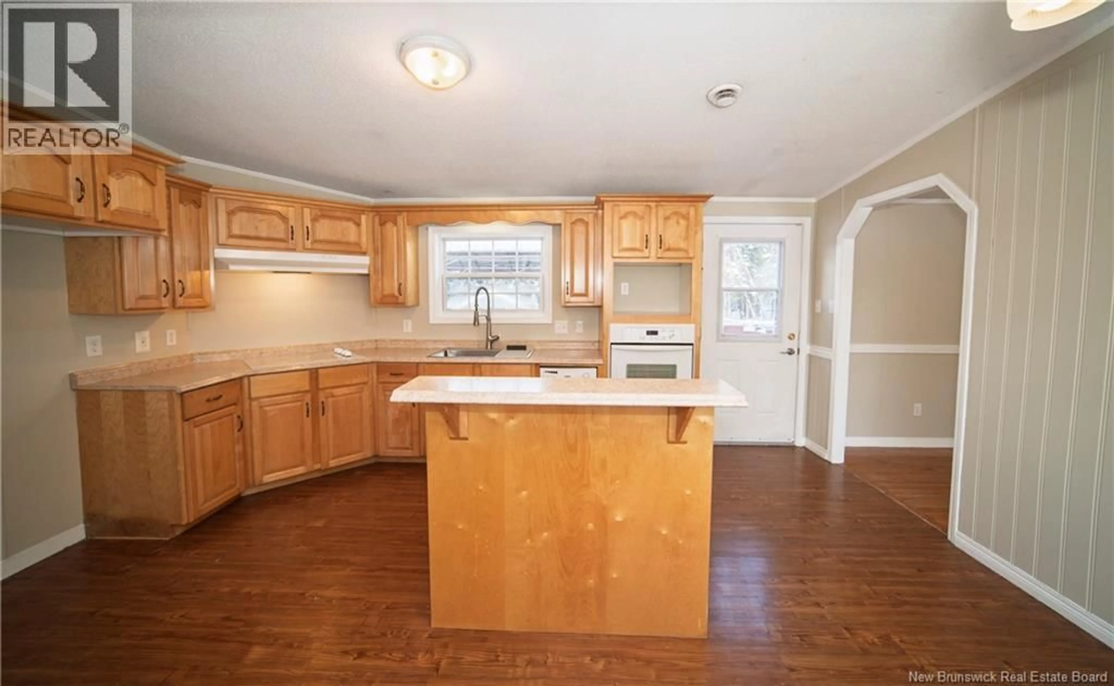 Open concept kitchen, wood/laminate floor for 4661 HERITAGE DRIVE, Tracy New Brunswick E5L1C6