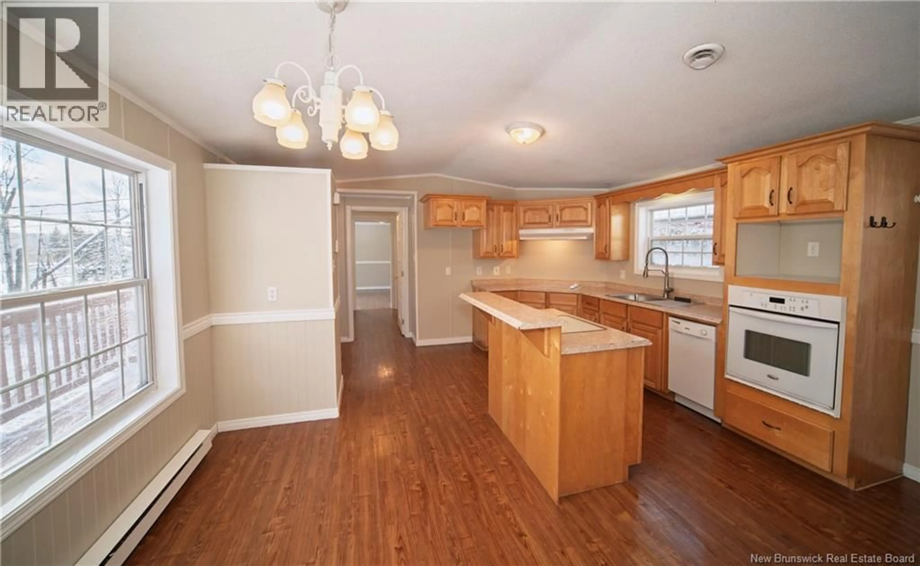 Open concept kitchen, wood/laminate floor for 4661 HERITAGE DRIVE, Tracy New Brunswick E5L1C6
