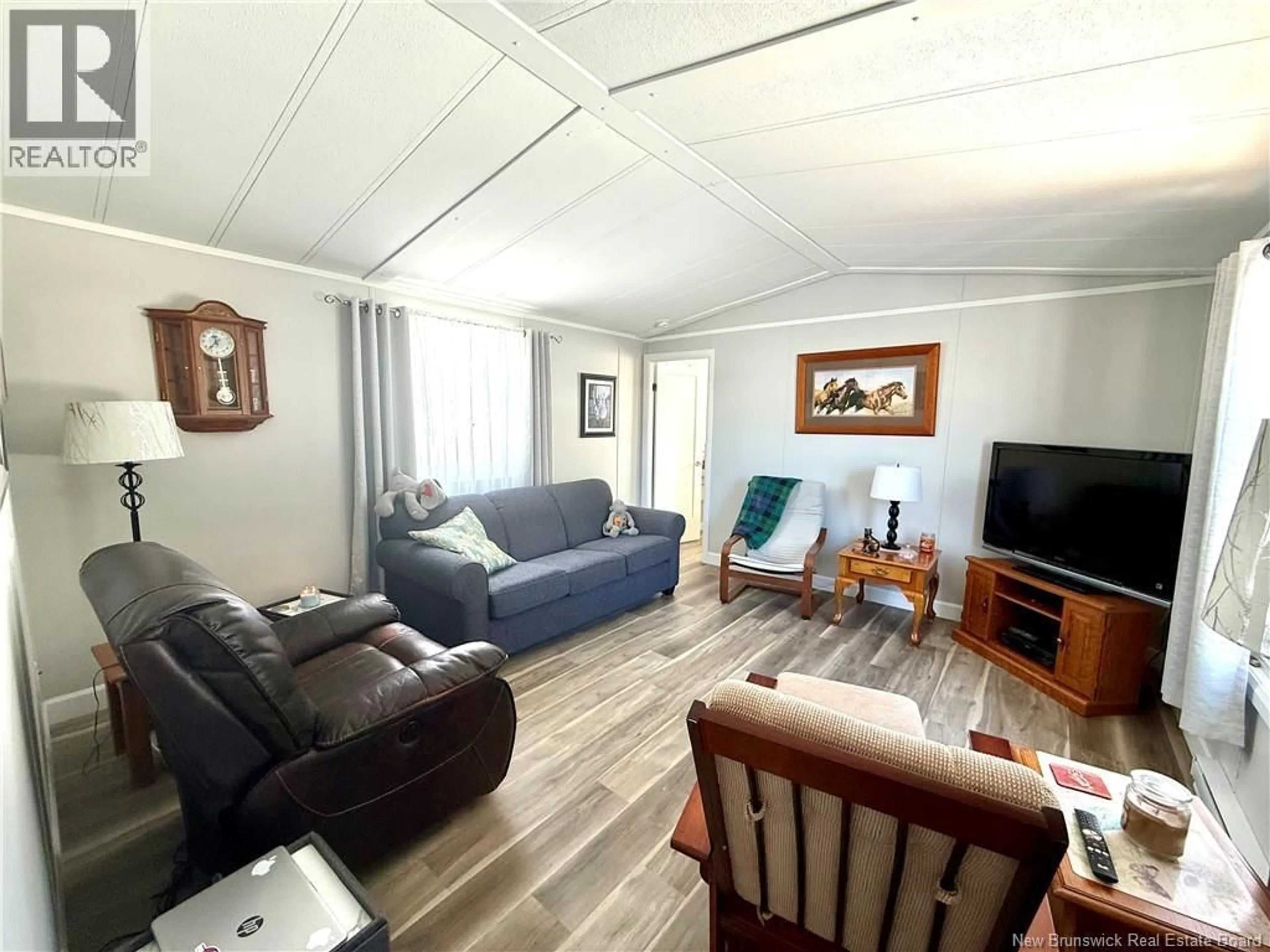 Living room with furniture, wood/laminate floor for 11 CONDON CRESCENT, Lakeville New Brunswick E1H1O6