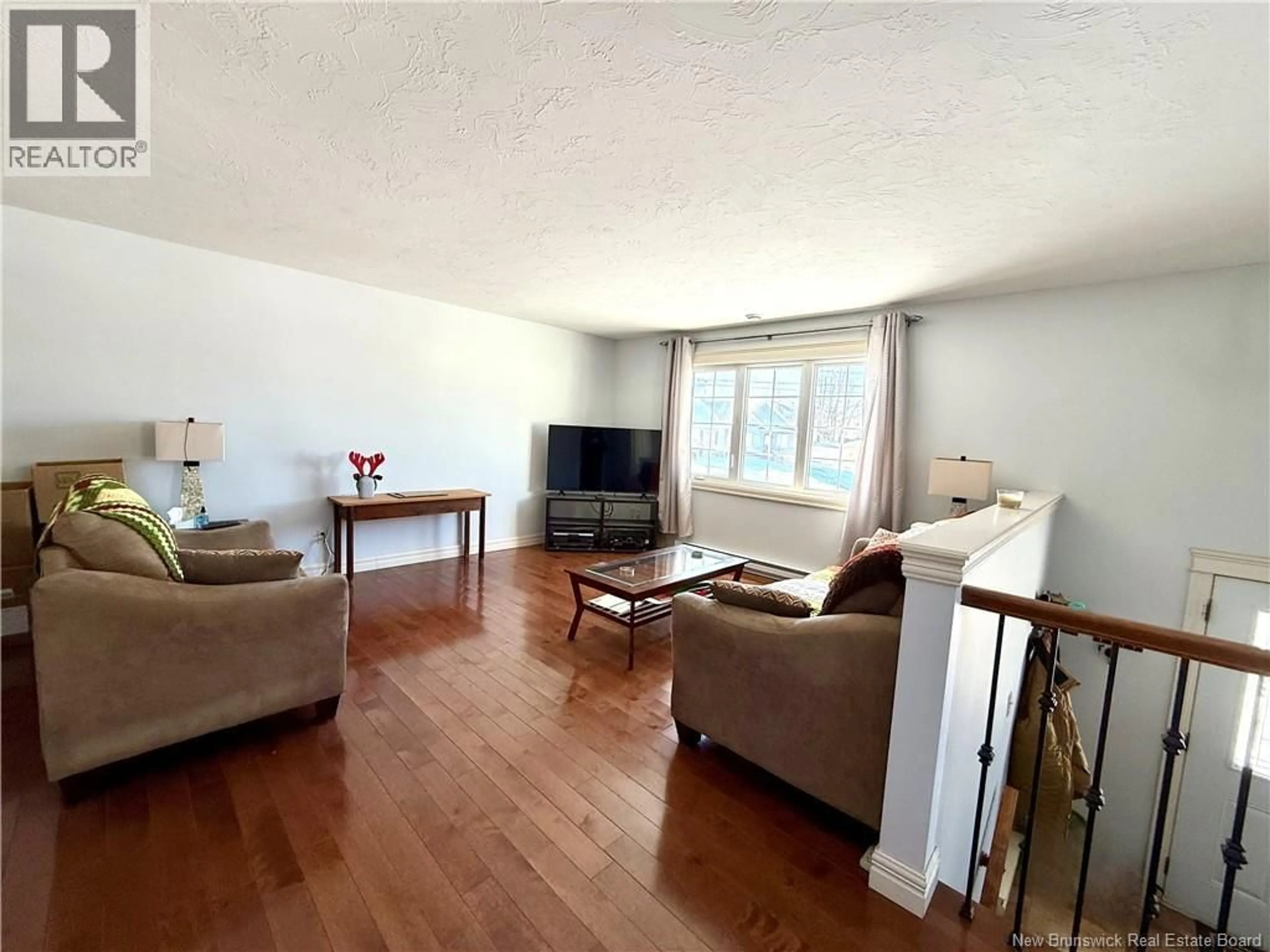 Living room with furniture, wood/laminate floor for 9 JEREMIE COURT, Moncton New Brunswick E1A0B7