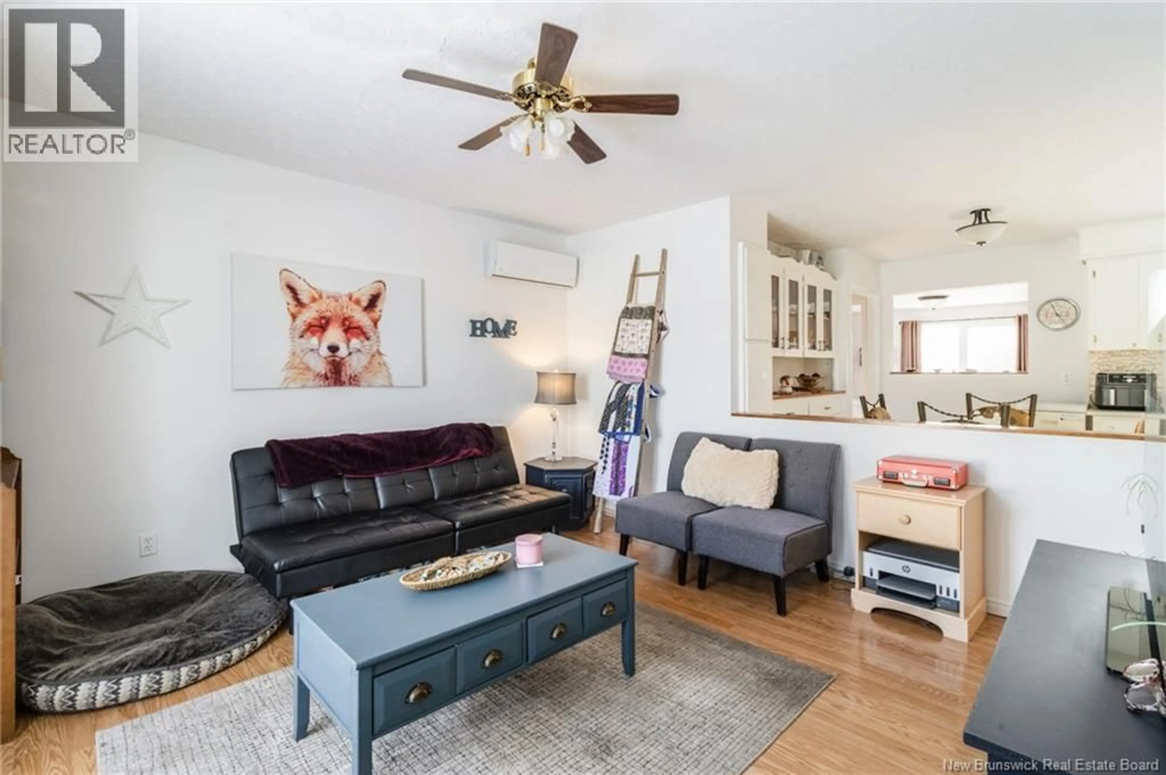 Living room with furniture, wood/laminate floor for 29 NASON CRESCENT, Oromocto New Brunswick E2V1K2