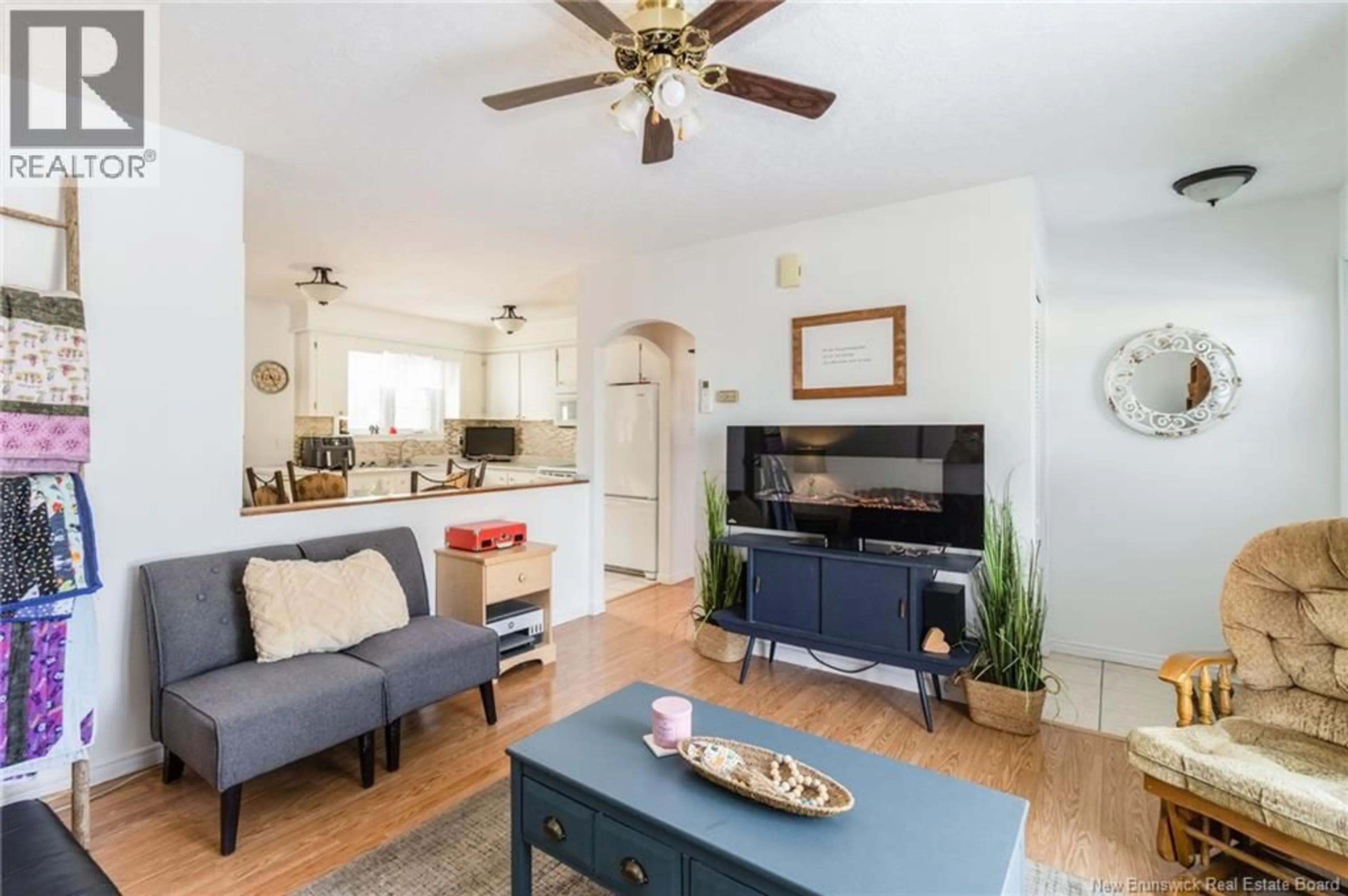 Living room with furniture, wood/laminate floor for 29 NASON CRESCENT, Oromocto New Brunswick E2V1K2