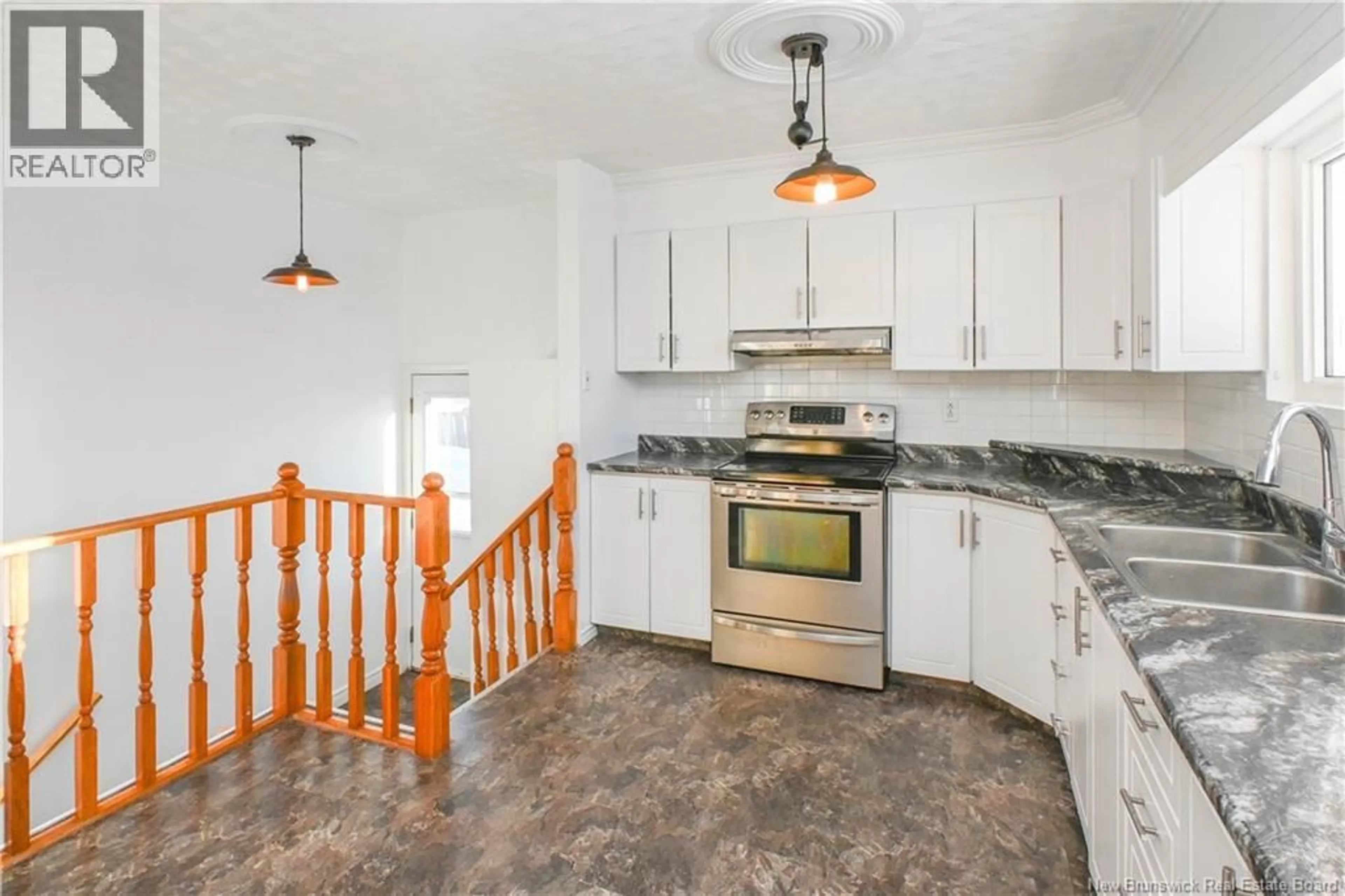 Open concept kitchen, ceramic/tile floor for 23 SAINT-SIMON ROAD, Caraquet New Brunswick E1W1B3