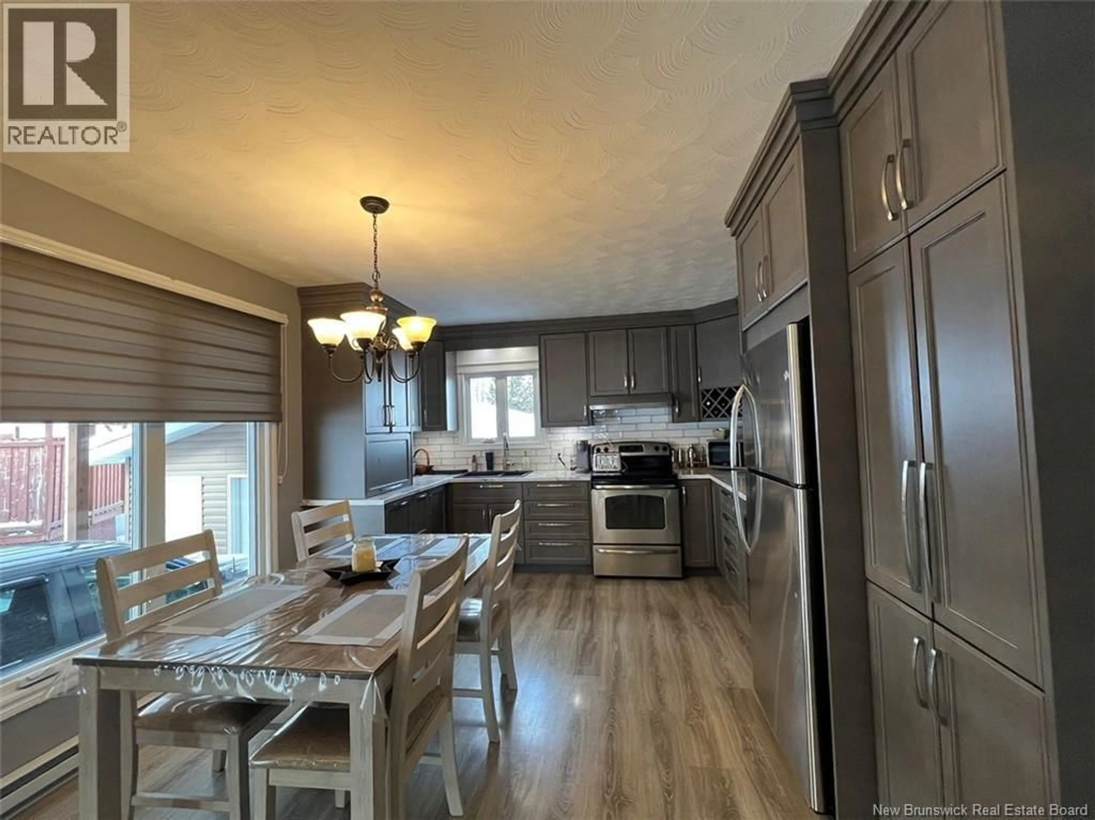 Open concept kitchen, wood/laminate floor for 8 EDGAR STREET, Saint-Basile New Brunswick E7C1N8