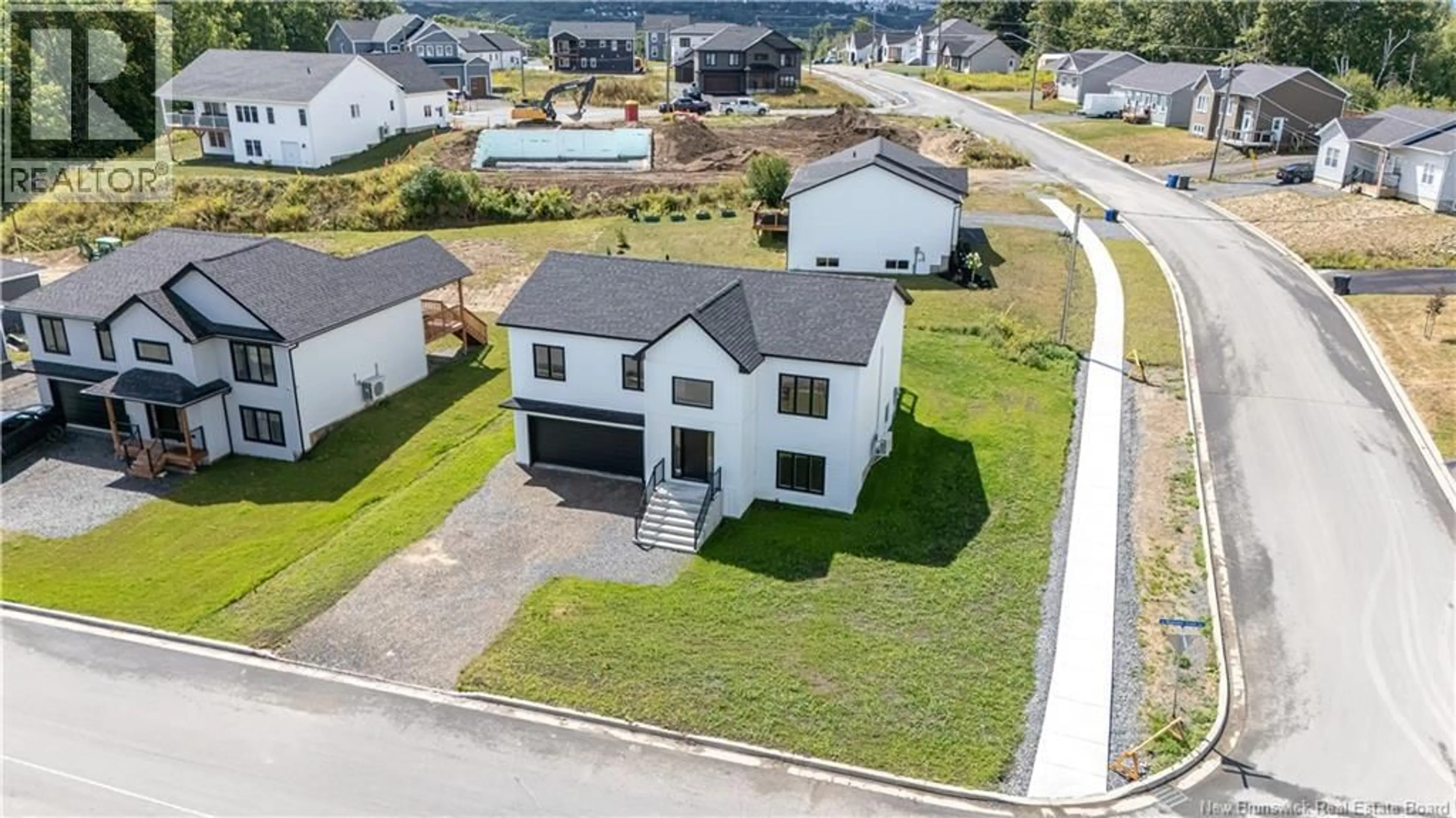 A pic from outside/outdoor area/front of a property/back of a property/a pic from drone, street for 141 REGIMENT CREEK AVENUE, Fredericton New Brunswick E3G0G3