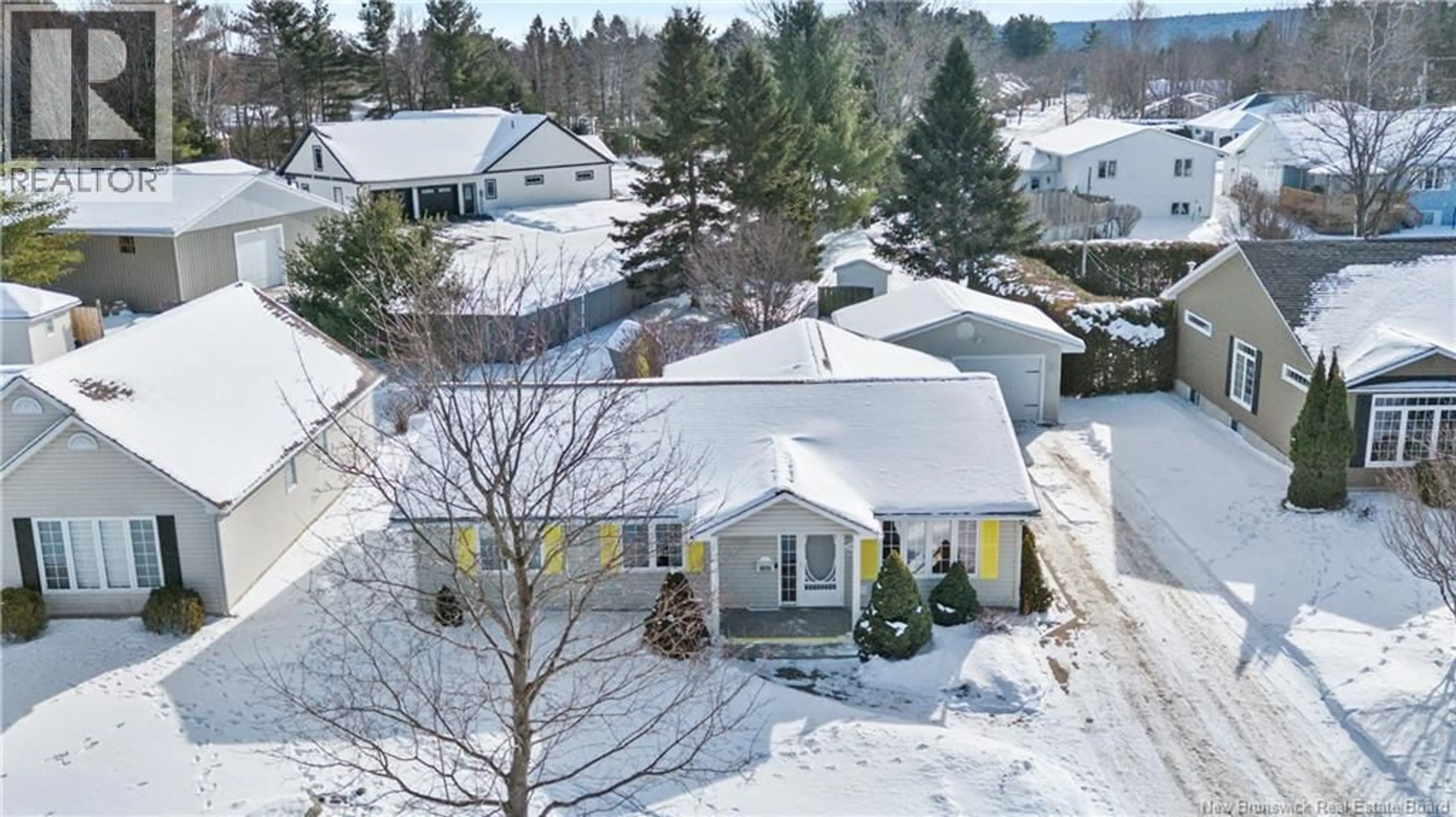 A pic from outside/outdoor area/front of a property/back of a property/a pic from drone, street for 207 MANRESA DRIVE, Fredericton New Brunswick E3A9S9