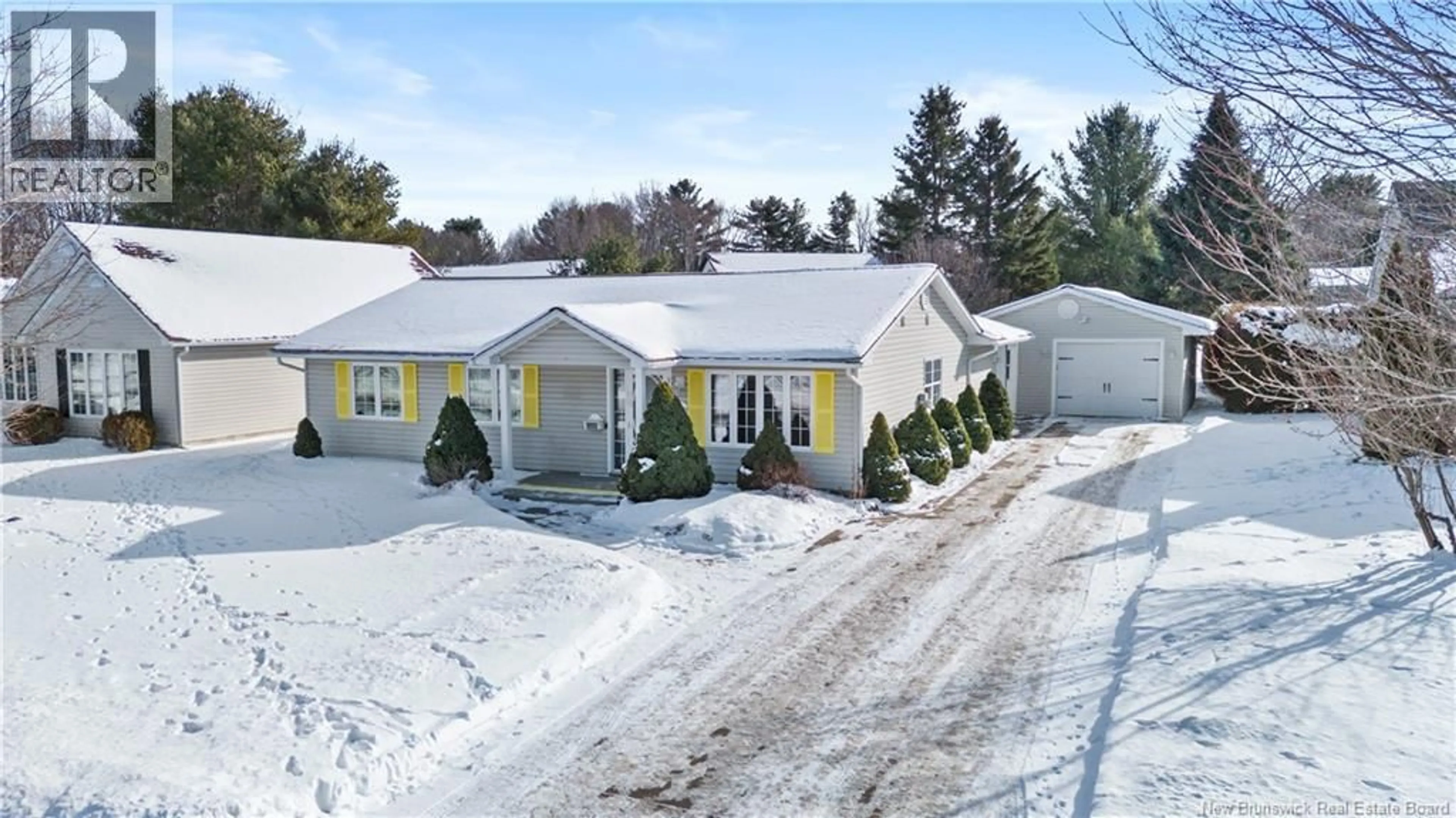 A pic from outside/outdoor area/front of a property/back of a property/a pic from drone, street for 207 MANRESA DRIVE, Fredericton New Brunswick E3A9S9