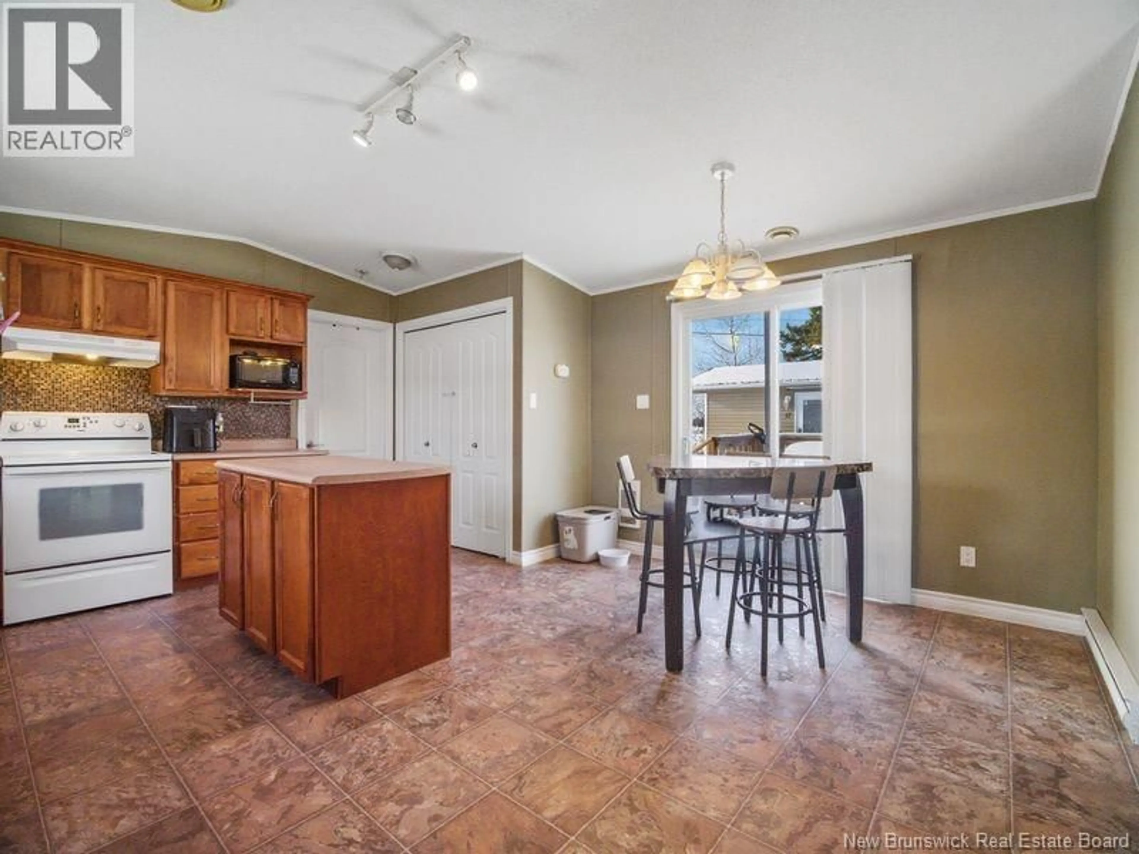 Open concept kitchen, ceramic/tile floor for 15 RIVER EAST DRIVE, Riverview New Brunswick E1B5B1