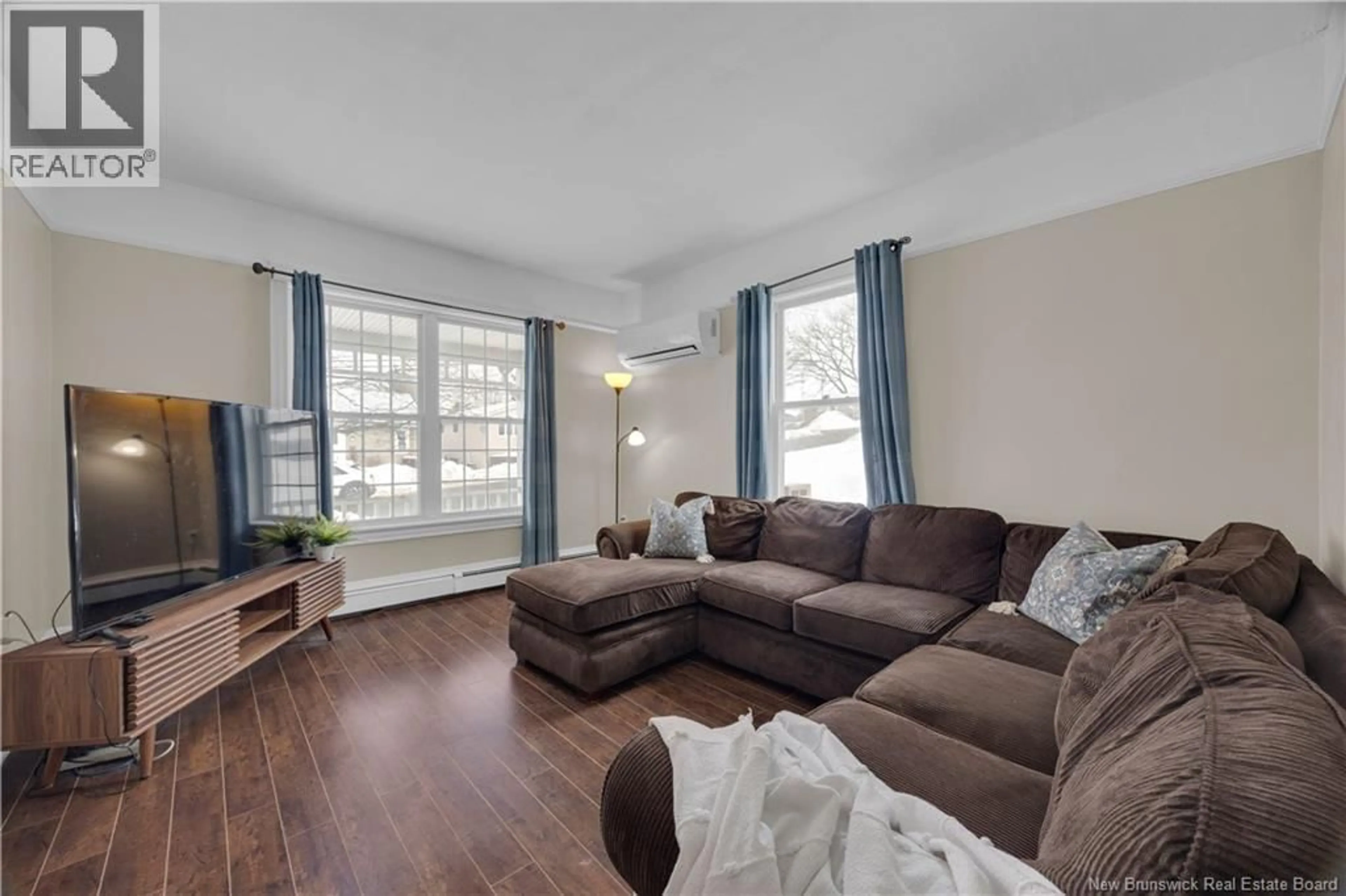 Living room with furniture, wood/laminate floor for 294 SHERBROOKE STREET, Saint John New Brunswick E2M3L2