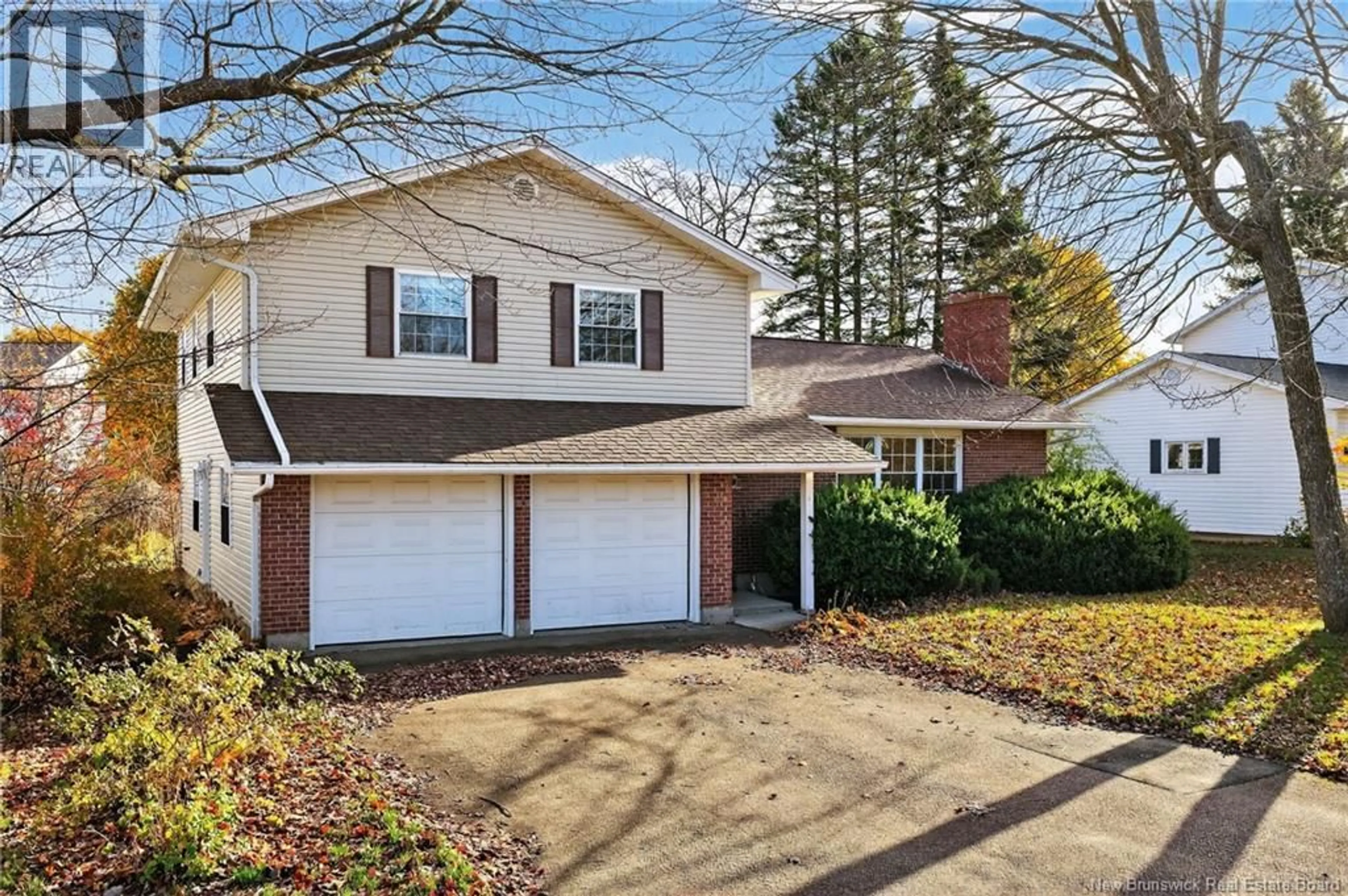 Home with vinyl exterior material, street for 18 GRINDSTONE DRIVE, Riverview New Brunswick E1B3N9