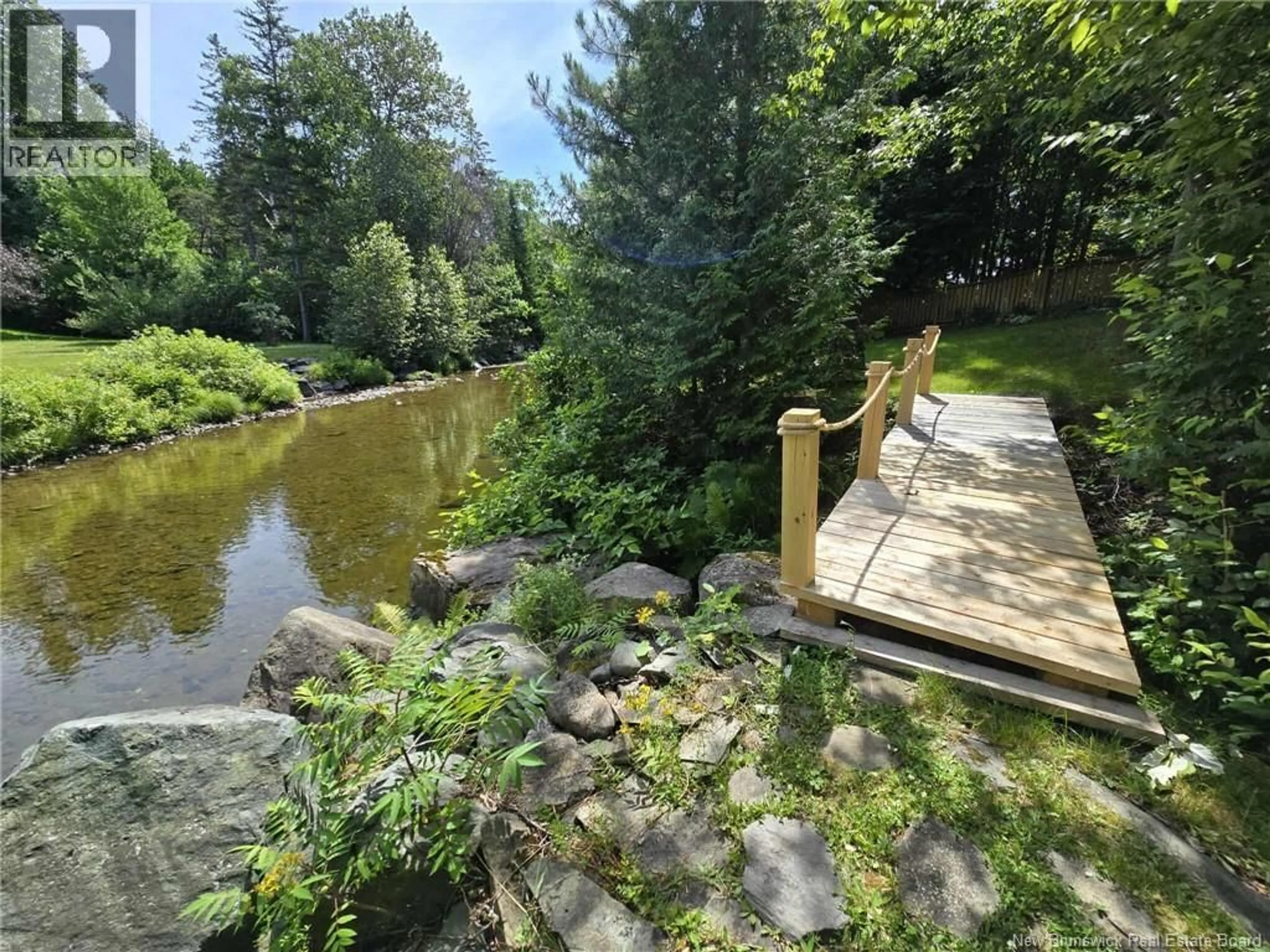 A pic from outside/outdoor area/front of a property/back of a property/a pic from drone, water/lake/river/ocean view for 398 LINDA STREET, Beresford New Brunswick E8K2C9