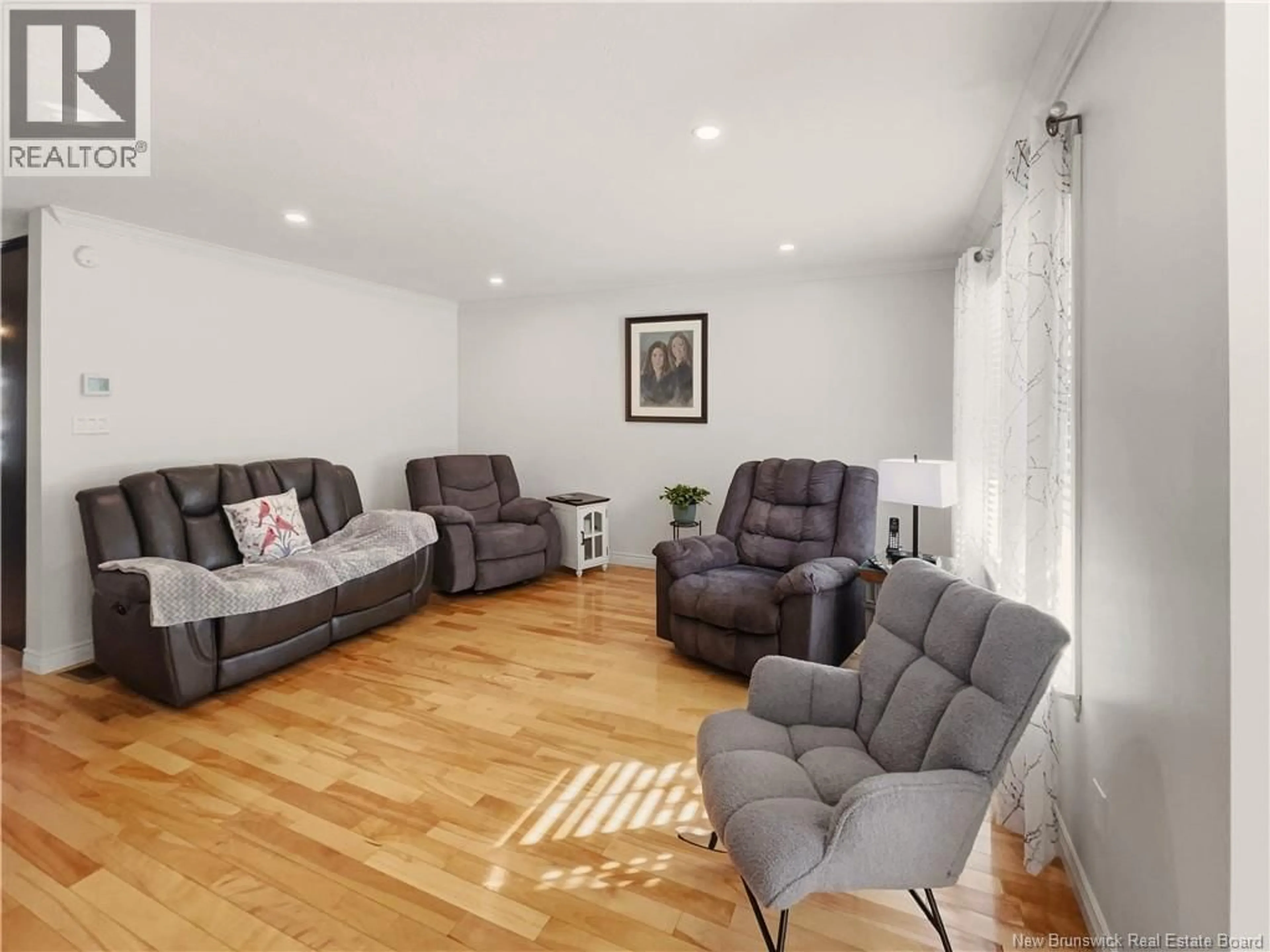 Living room with furniture, wood/laminate floor for 9 BERRY STREET, Moncton New Brunswick E1A6G3