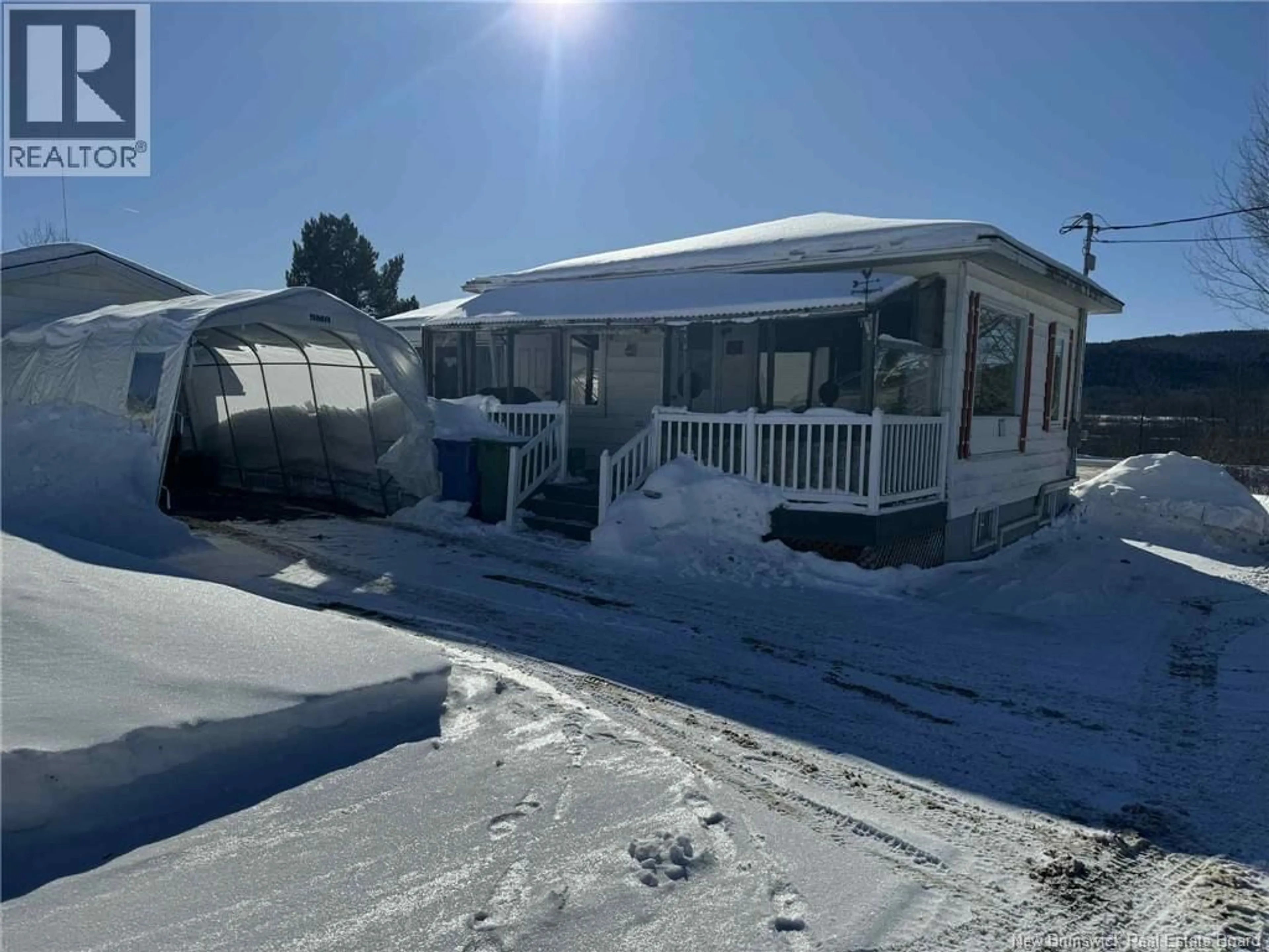 A pic from outside/outdoor area/front of a property/back of a property/a pic from drone, street for 2 RUE PHILIPPE, Sainte-Anne-De-Madawaska New Brunswick E7E1C2