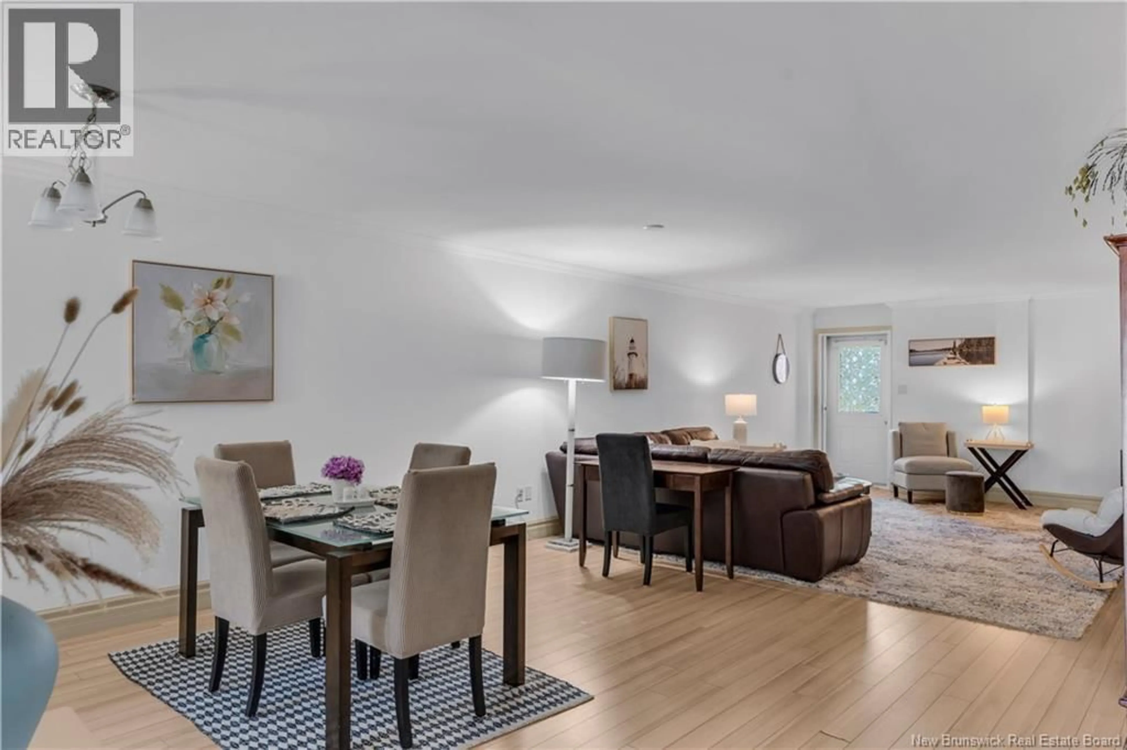 Living room with furniture, wood/laminate floor for 105 - 98 PLEASANT STREET, Shediac New Brunswick E4P2L6