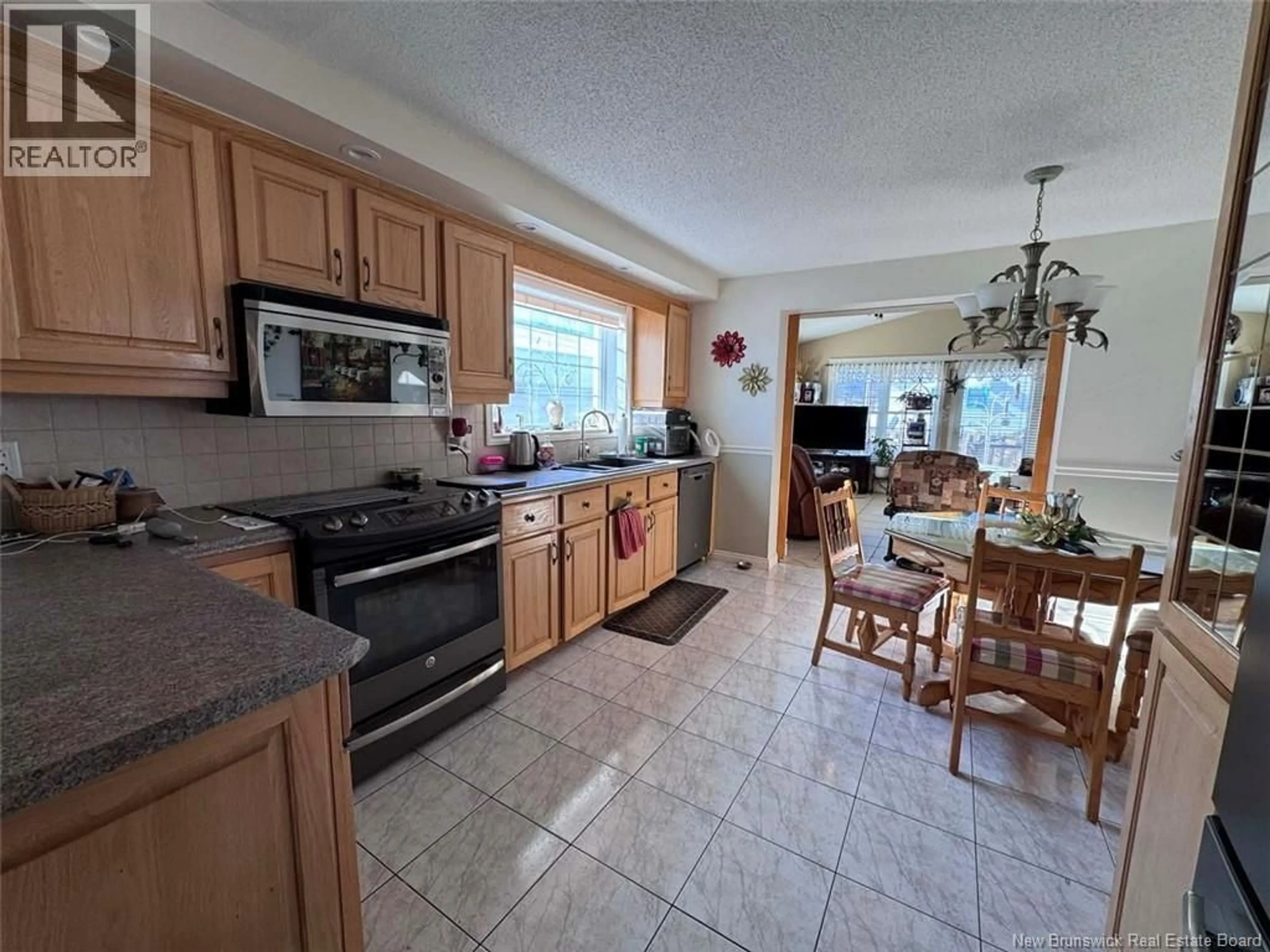 Open concept kitchen, ceramic/tile floor for 42 39TH AVENUE, Edmundston New Brunswick E3V2X2