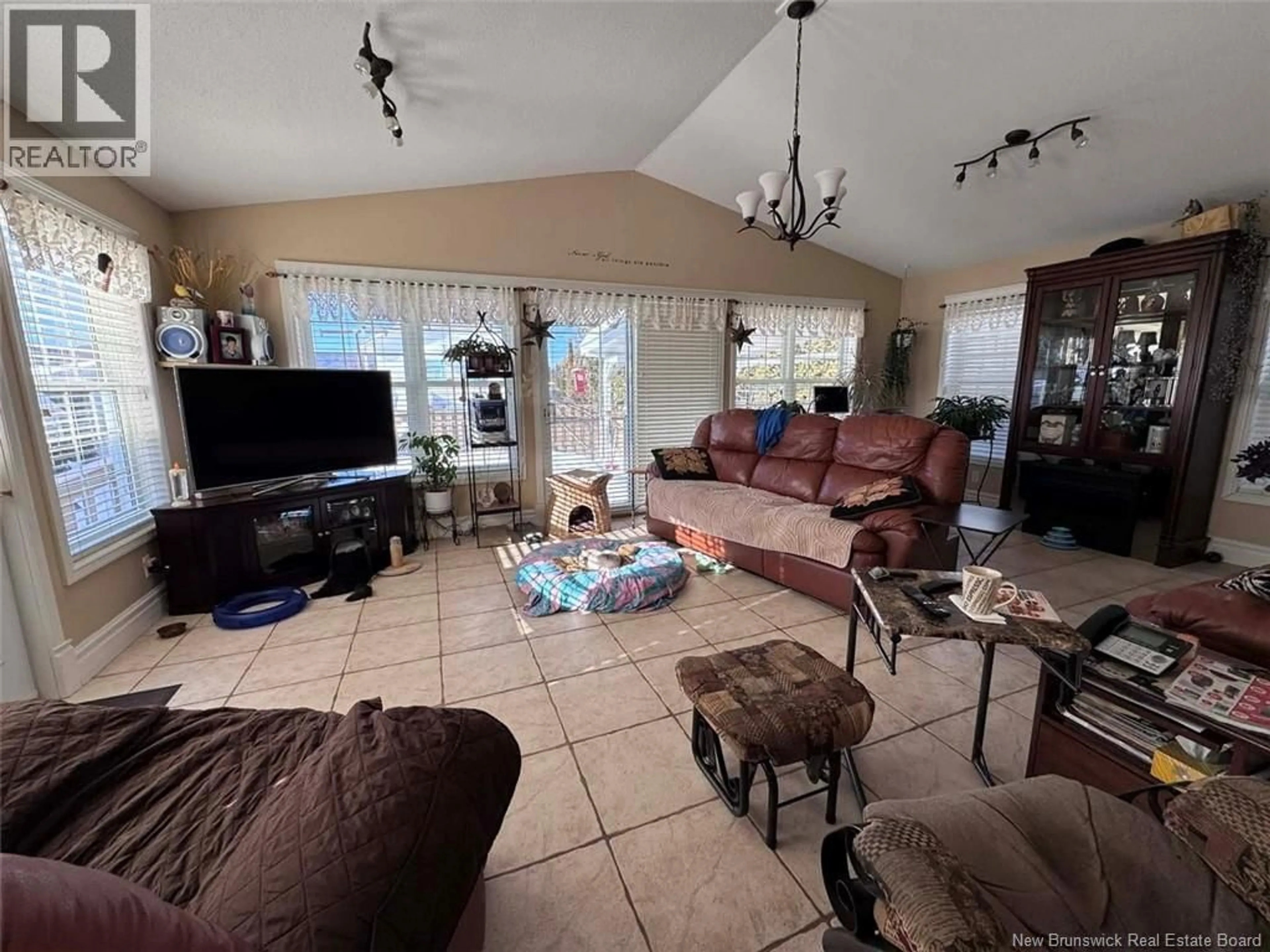 Living room with furniture, ceramic/tile floor for 42 39TH AVENUE, Edmundston New Brunswick E3V2X2