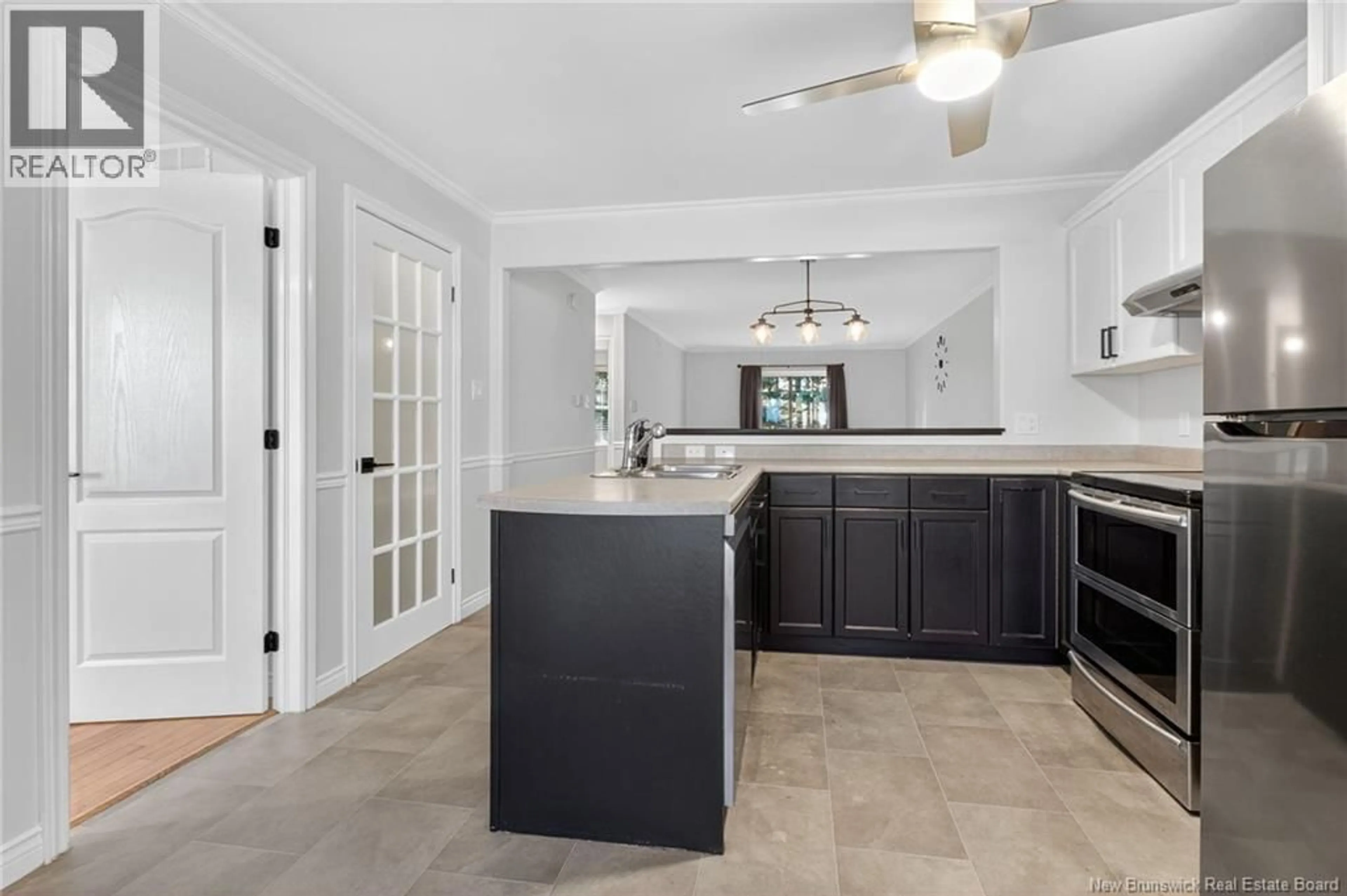 Open concept kitchen, ceramic/tile floor for 21 FIRMIN CRESCENT, Dieppe New Brunswick E1A7T1