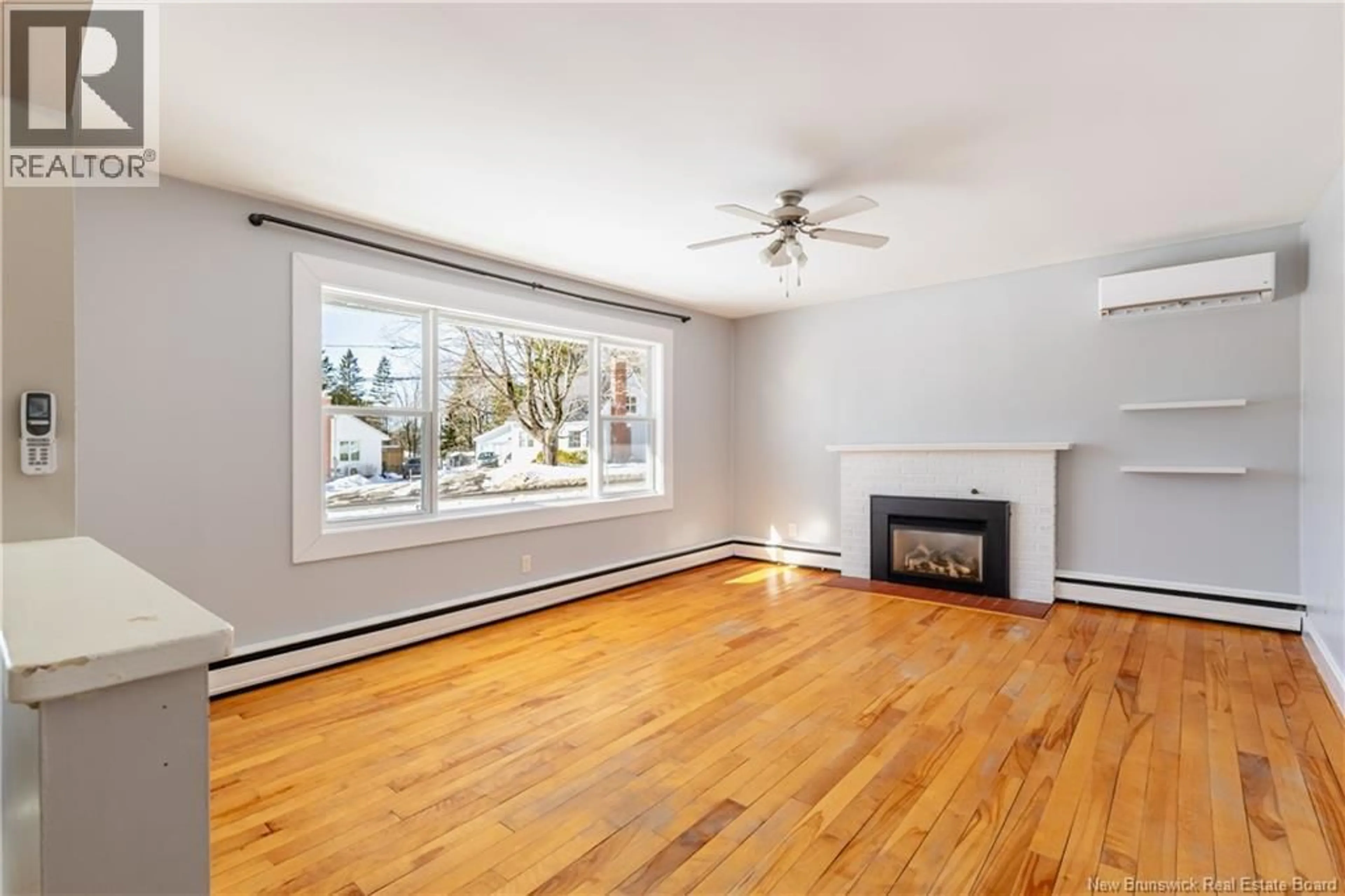 Living room with furniture, wood/laminate floor for 208 FULTON AVENUE, Fredericton New Brunswick E3G6B2