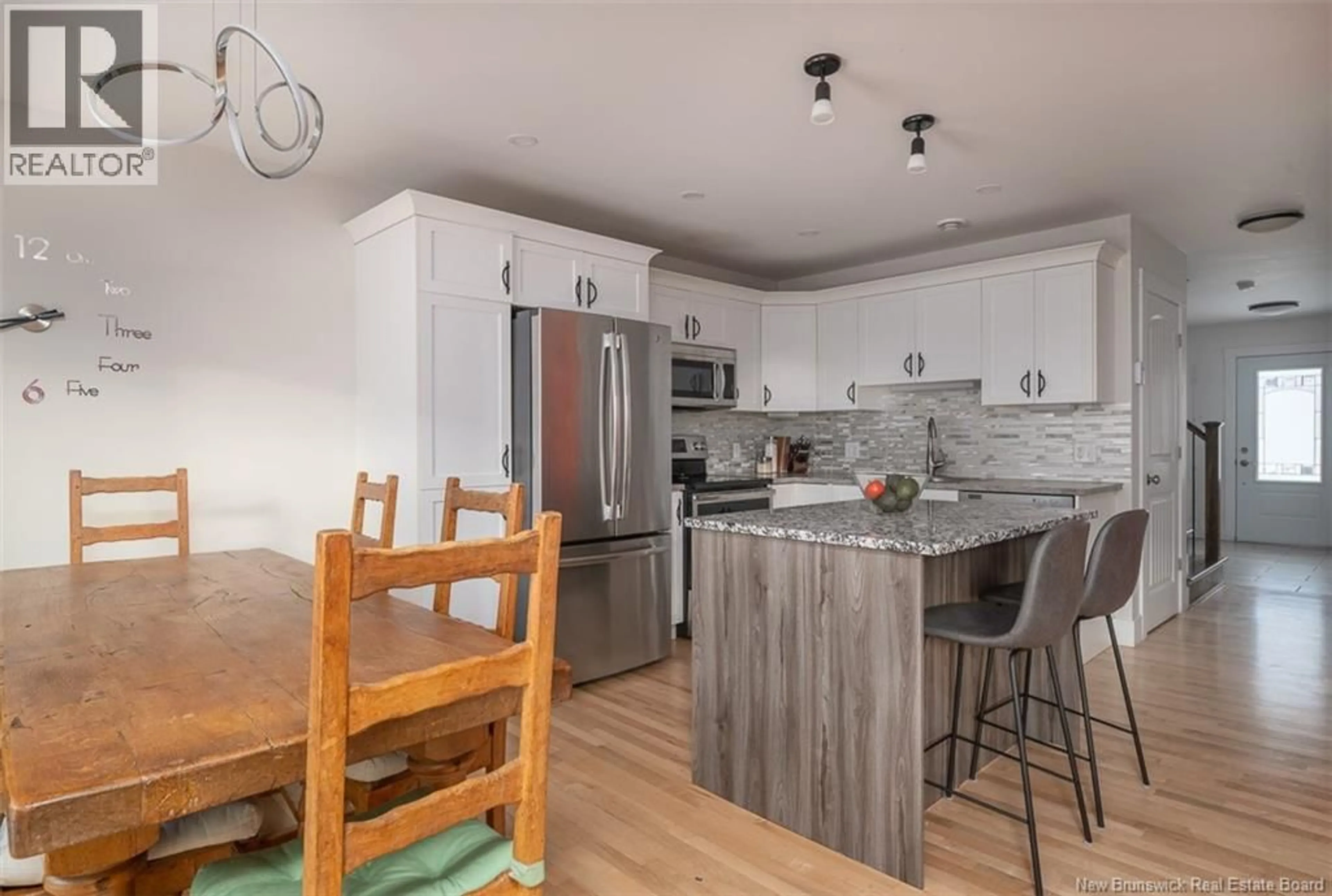 Open concept kitchen, wood/laminate floor for 38 MIA CIRCLE, Fredericton New Brunswick E3A7N5