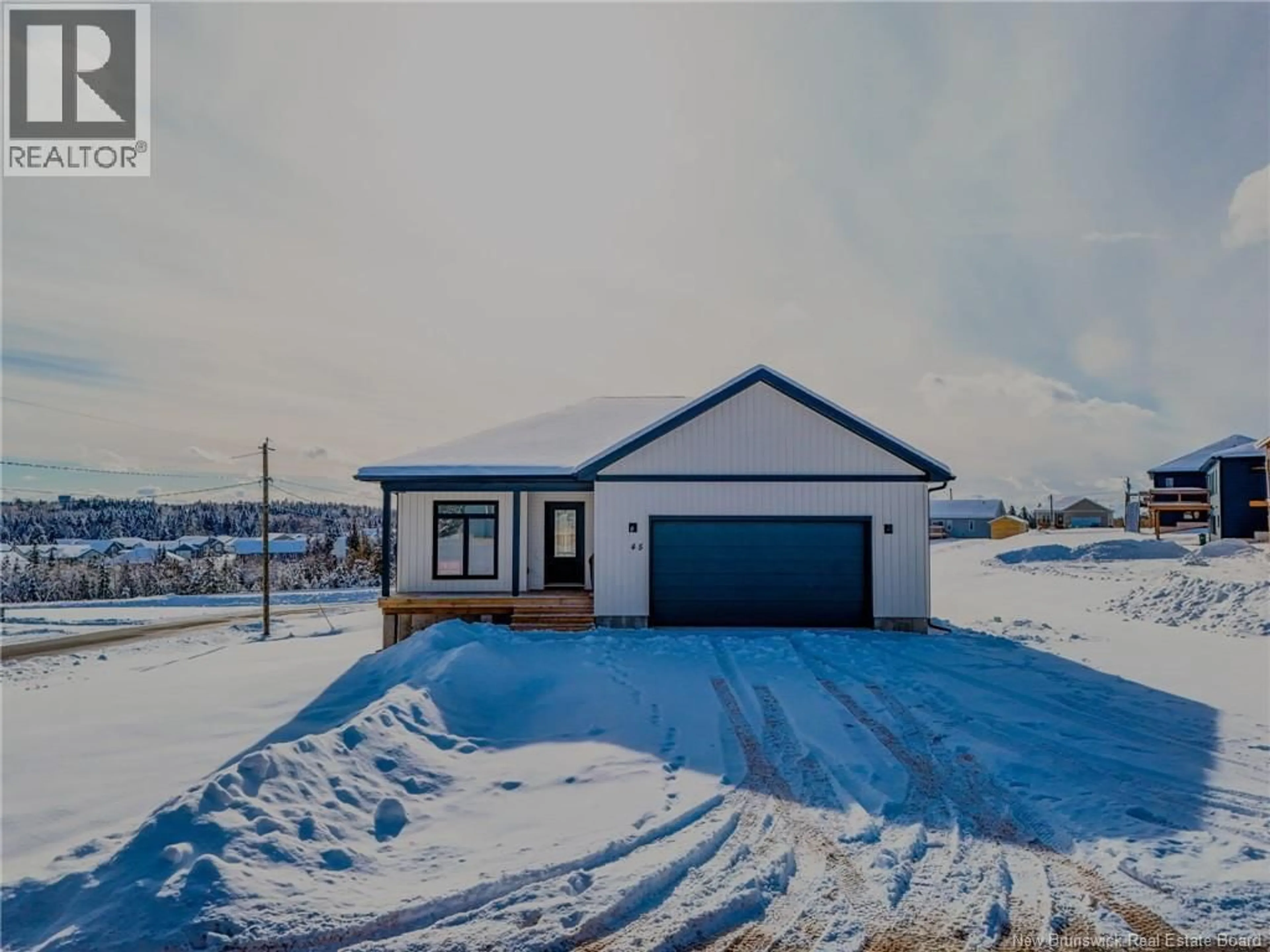 A pic from outside/outdoor area/front of a property/back of a property/a pic from drone, street for 45 MERLIN DRIVE, Quispamsis New Brunswick E2E0Y5