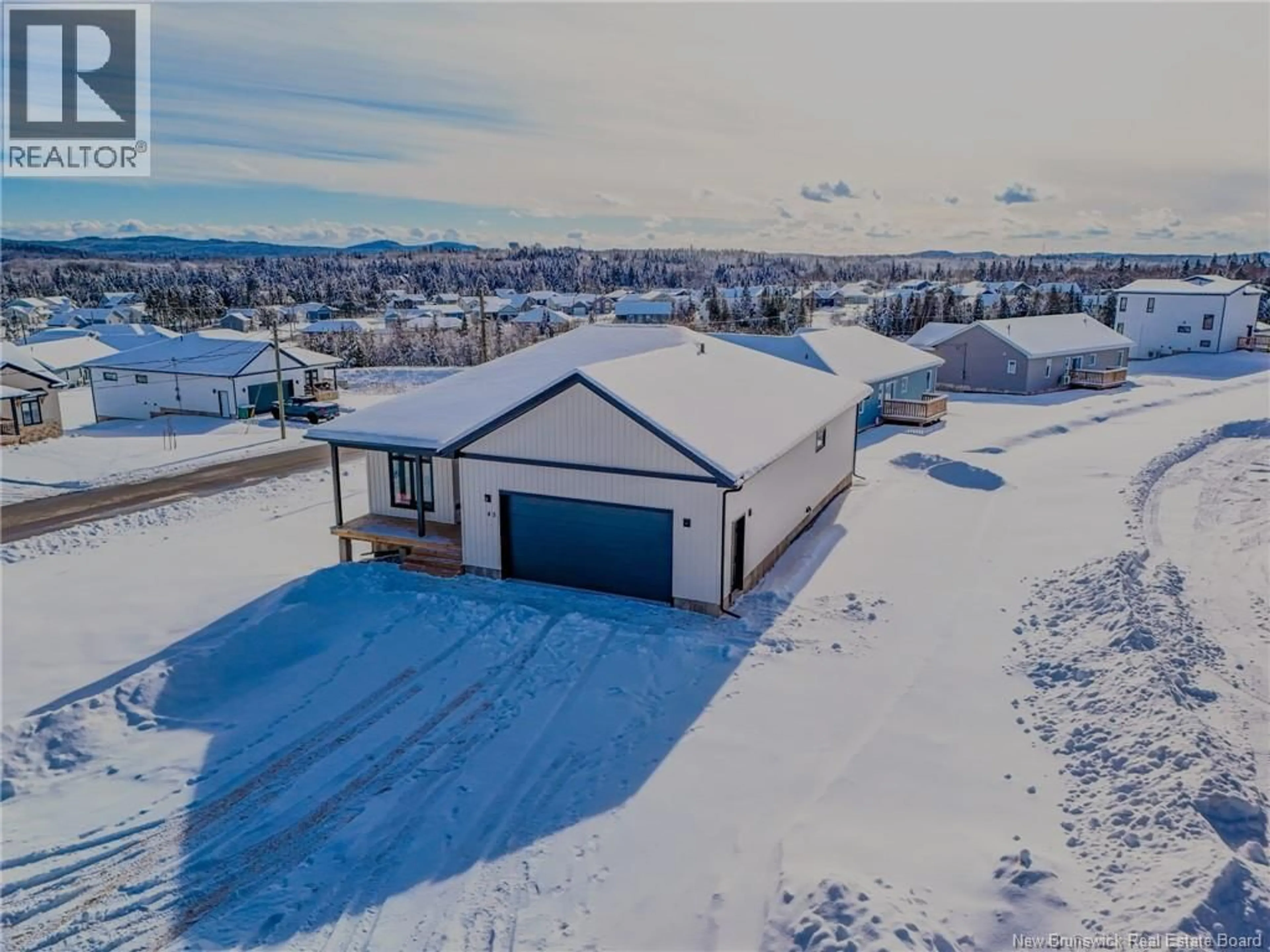 A pic from outside/outdoor area/front of a property/back of a property/a pic from drone, unknown for 45 MERLIN DRIVE, Quispamsis New Brunswick E2E0Y5