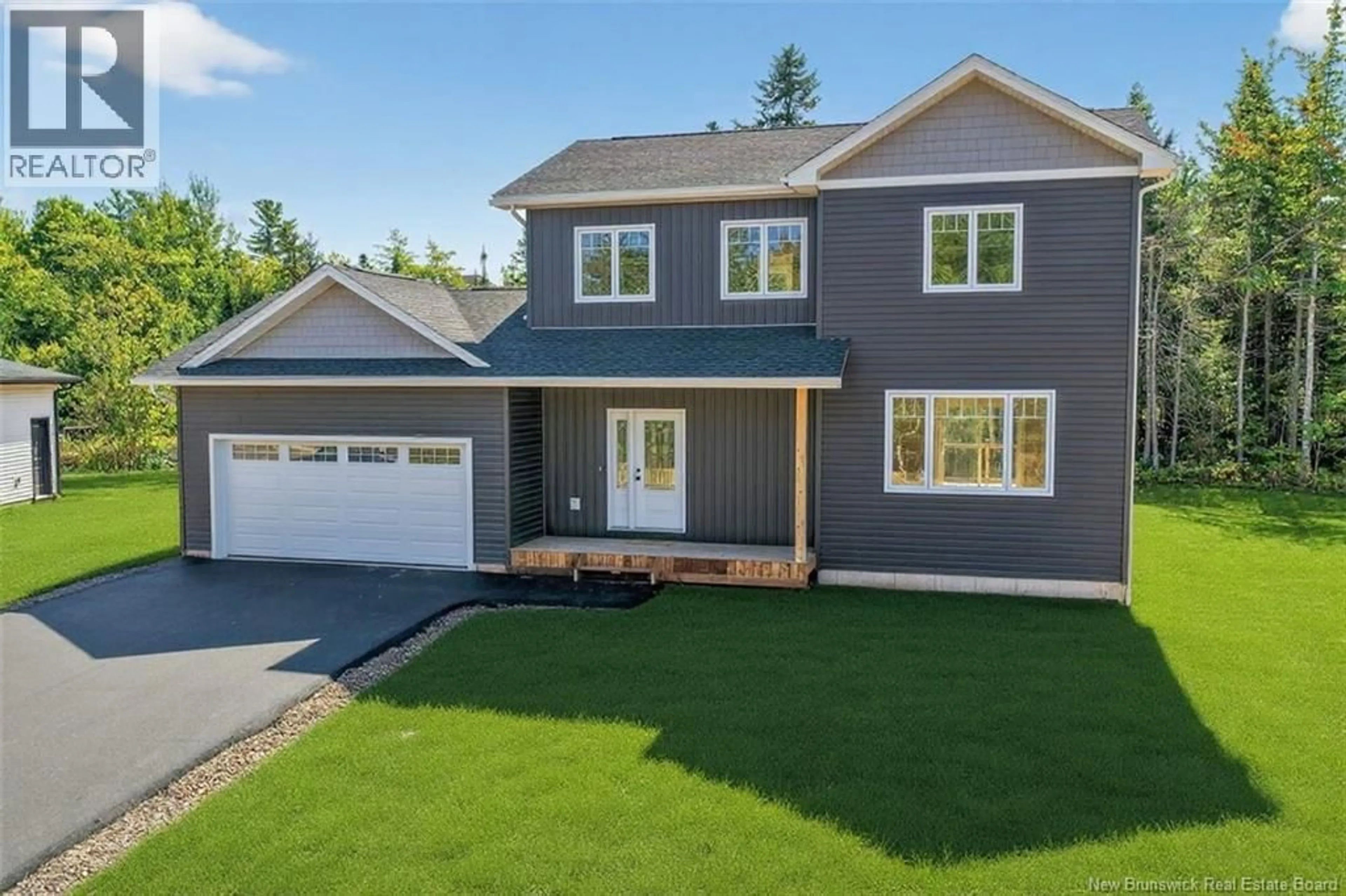 Home with vinyl exterior material, street for 26 CARTER STREET, Dieppe New Brunswick E1A0G4