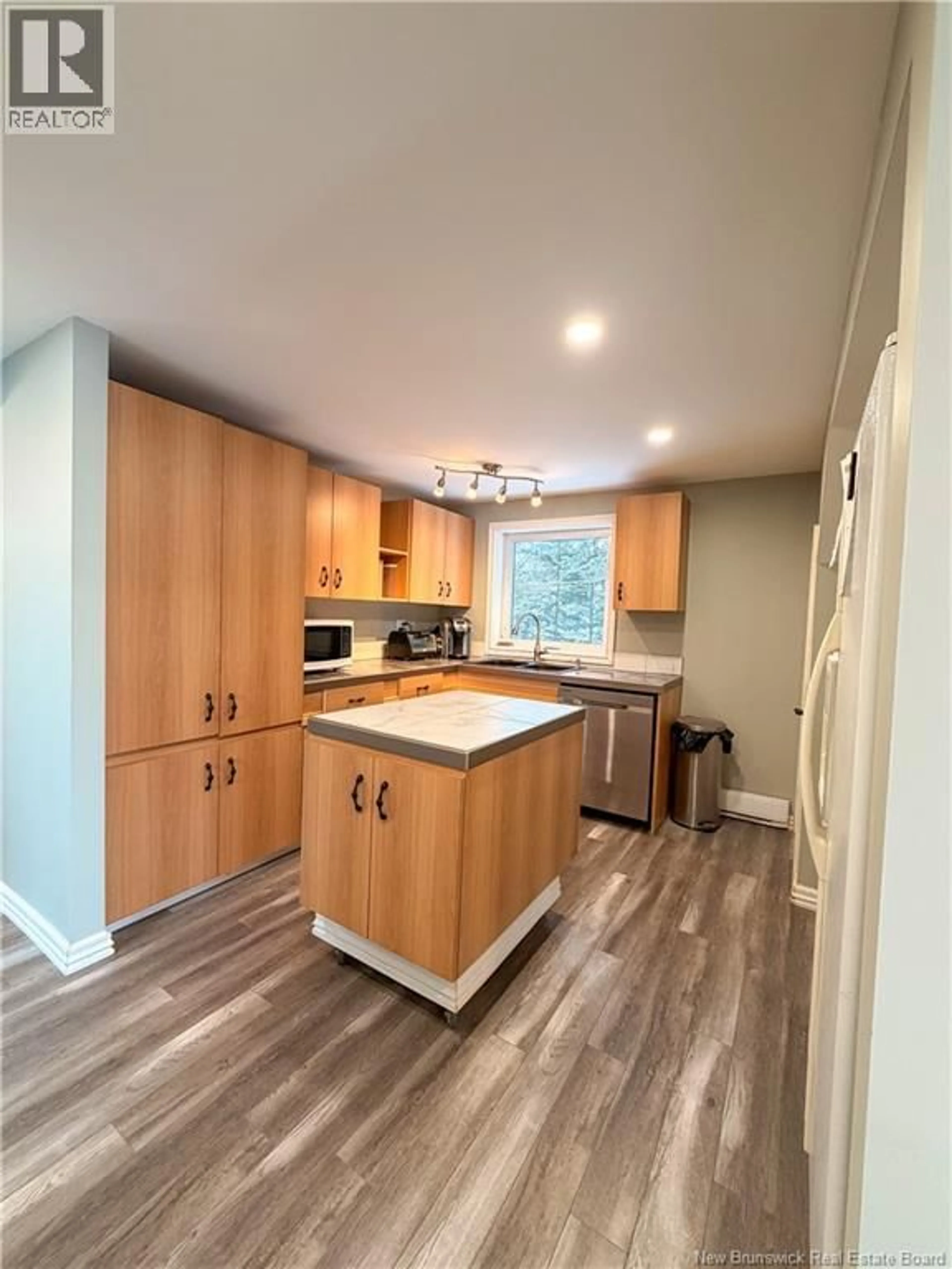Open concept kitchen, wood/laminate floor for 490 CHALEUR STREET, Charlo New Brunswick E8E2G5