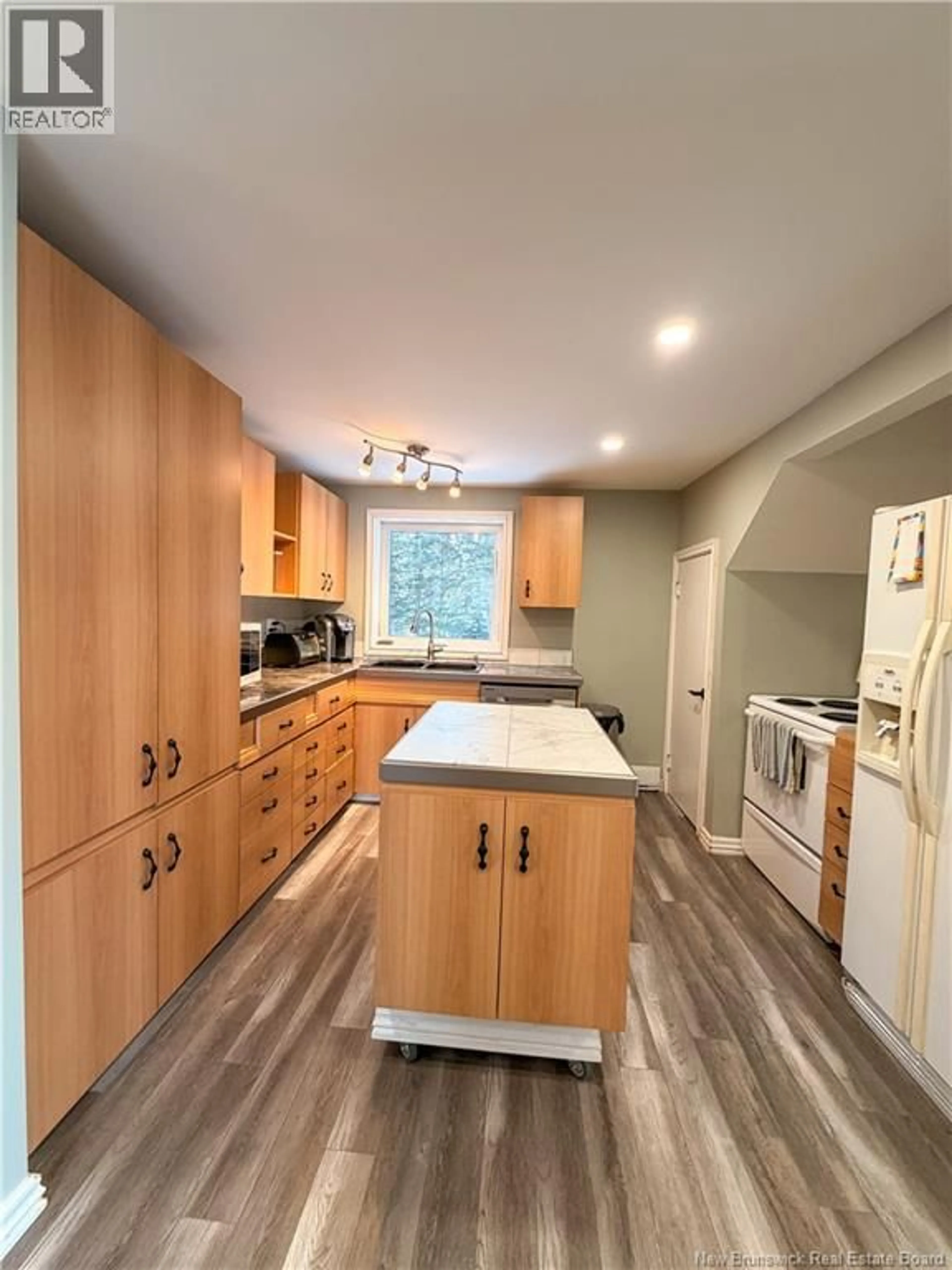 Open concept kitchen, wood/laminate floor for 490 CHALEUR STREET, Charlo New Brunswick E8E2G5