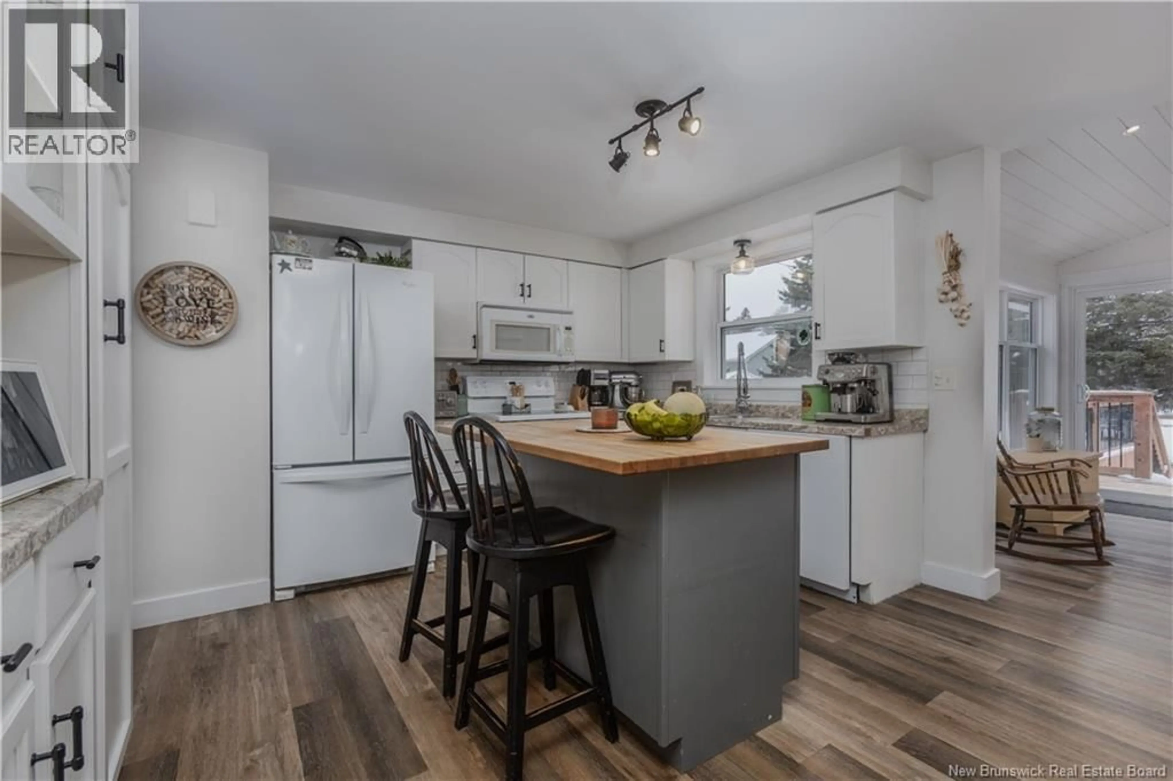 Open concept kitchen, wood/laminate floor for 21 CHAMPLAIN, Bouctouche New Brunswick E4S2Y7