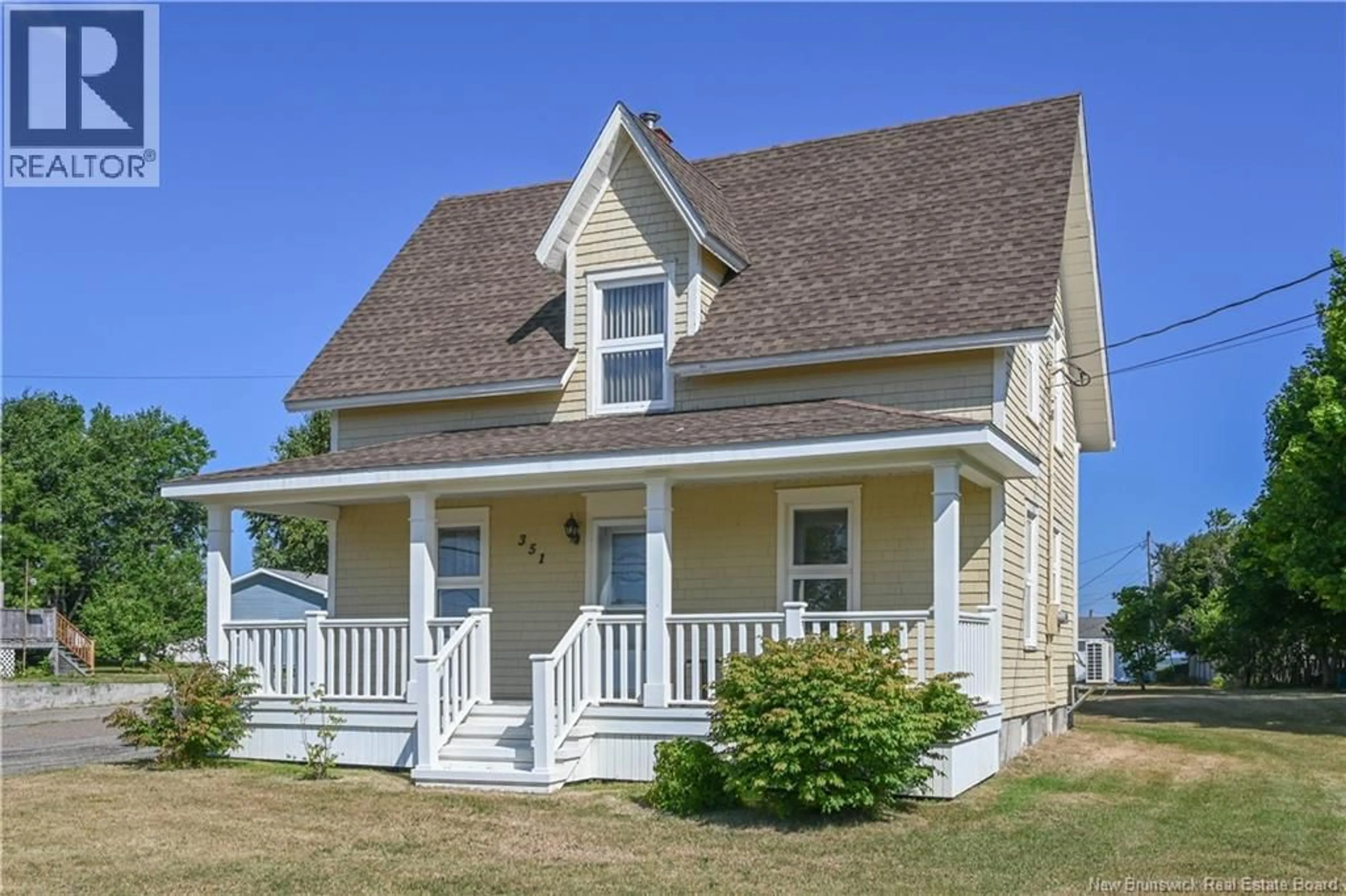 Home with vinyl exterior material, street for 351 SAINT-PIERRE BOULEVARD, Caraquet New Brunswick E1W1B4