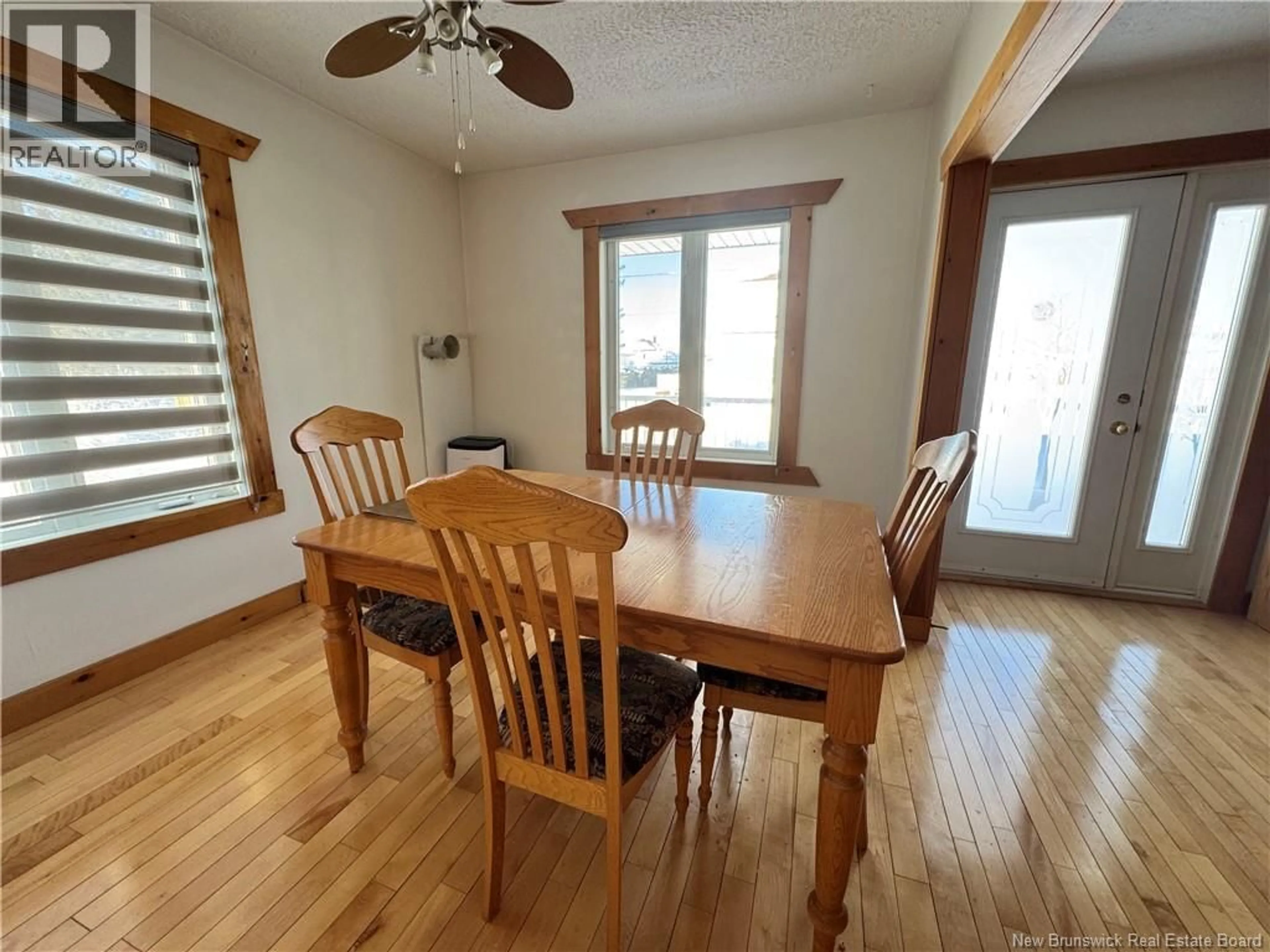 Dining room, wood/laminate floor for 17 EVANGELINE STREET, Saint-Quentin New Brunswick E8A1M8