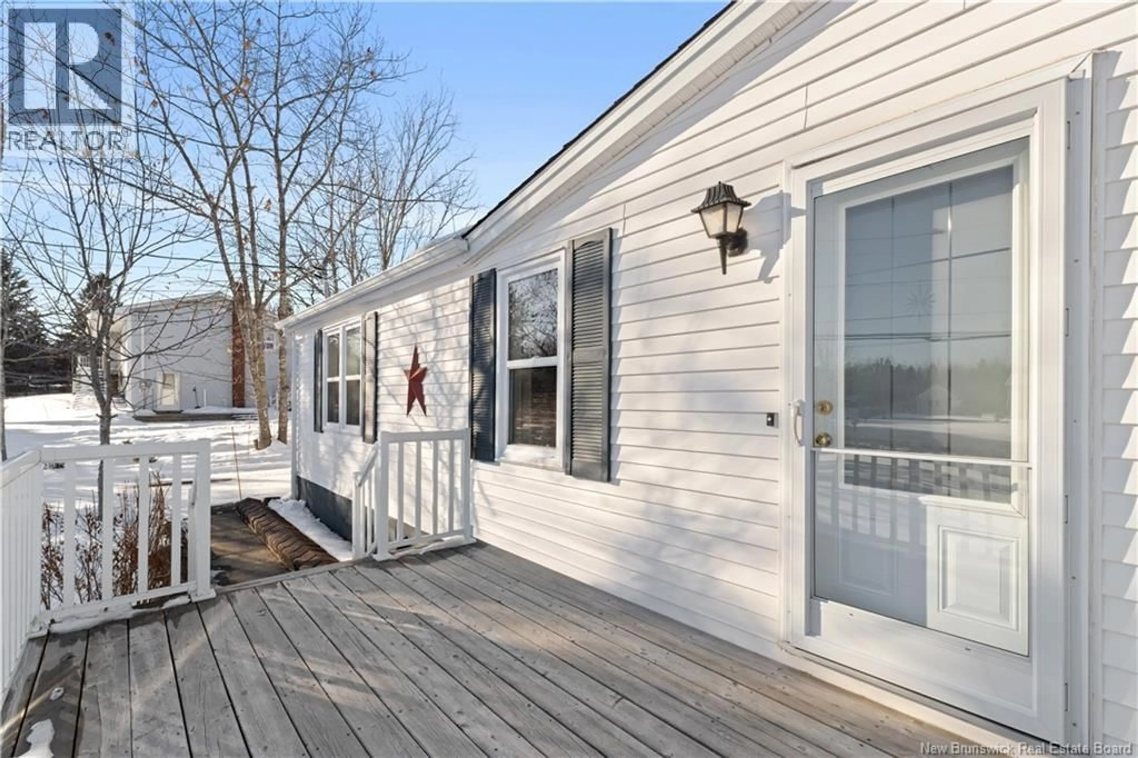 Home with vinyl exterior material, street for 61 COMMUNICATION ROAD, Irishtown New Brunswick E1H2G3