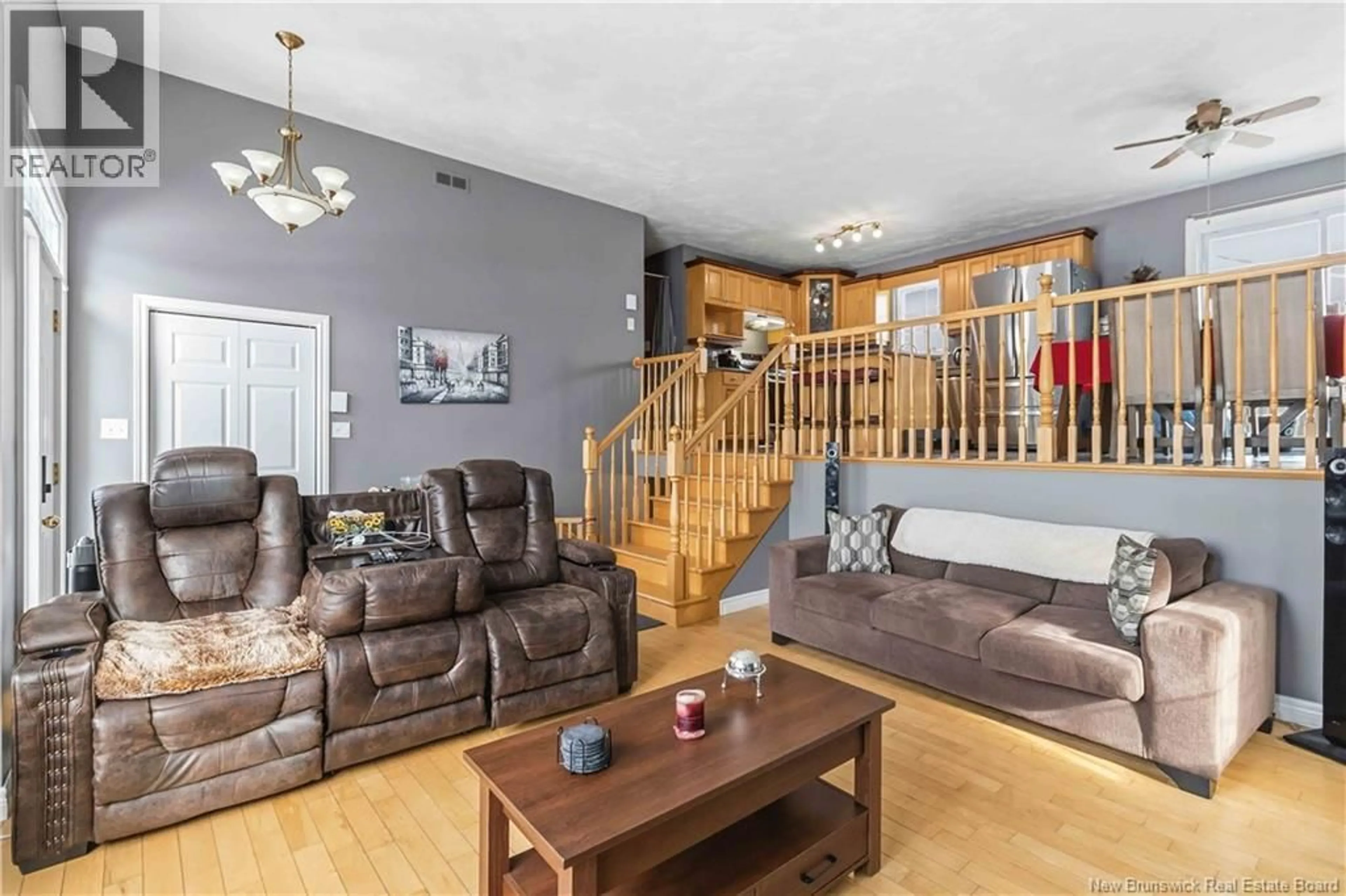 Living room with furniture, wood/laminate floor for 33 LOTUSROW DRIVE, Moncton New Brunswick E1E4W1