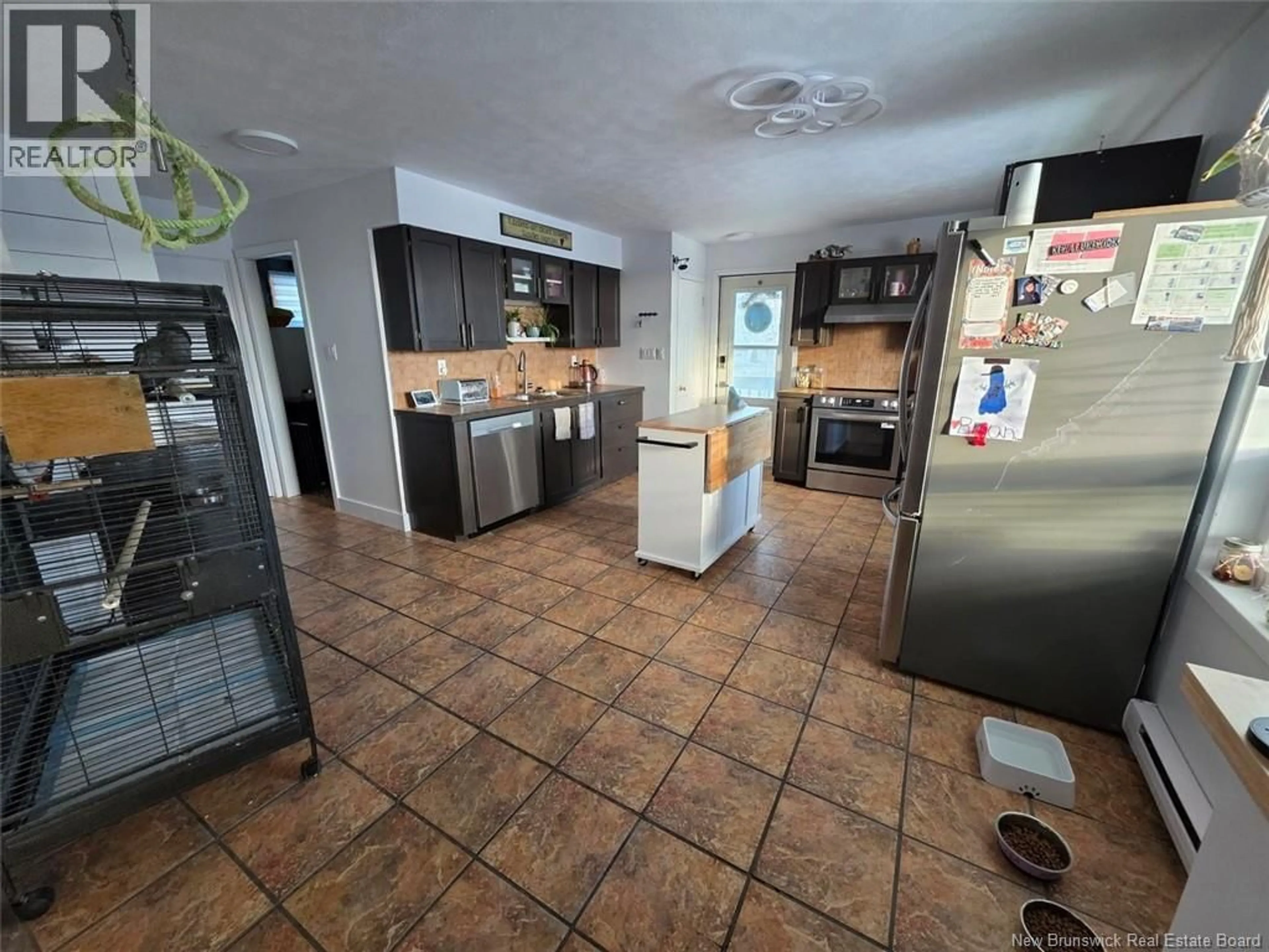 Open concept kitchen, ceramic/tile floor for 32 CORNO STREET, Saint-Basile New Brunswick E7C1P7