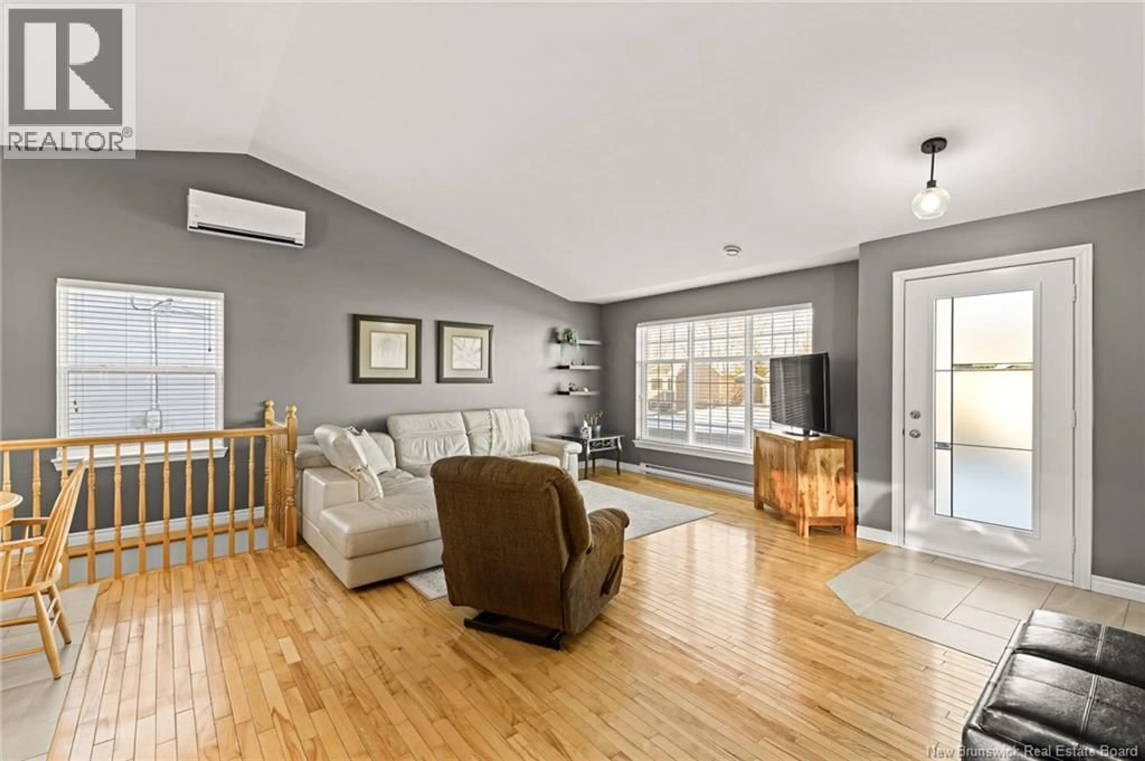 Living room with furniture, wood/laminate floor for 33 RAPHAEL STREET, Dieppe New Brunswick E1A8S3
