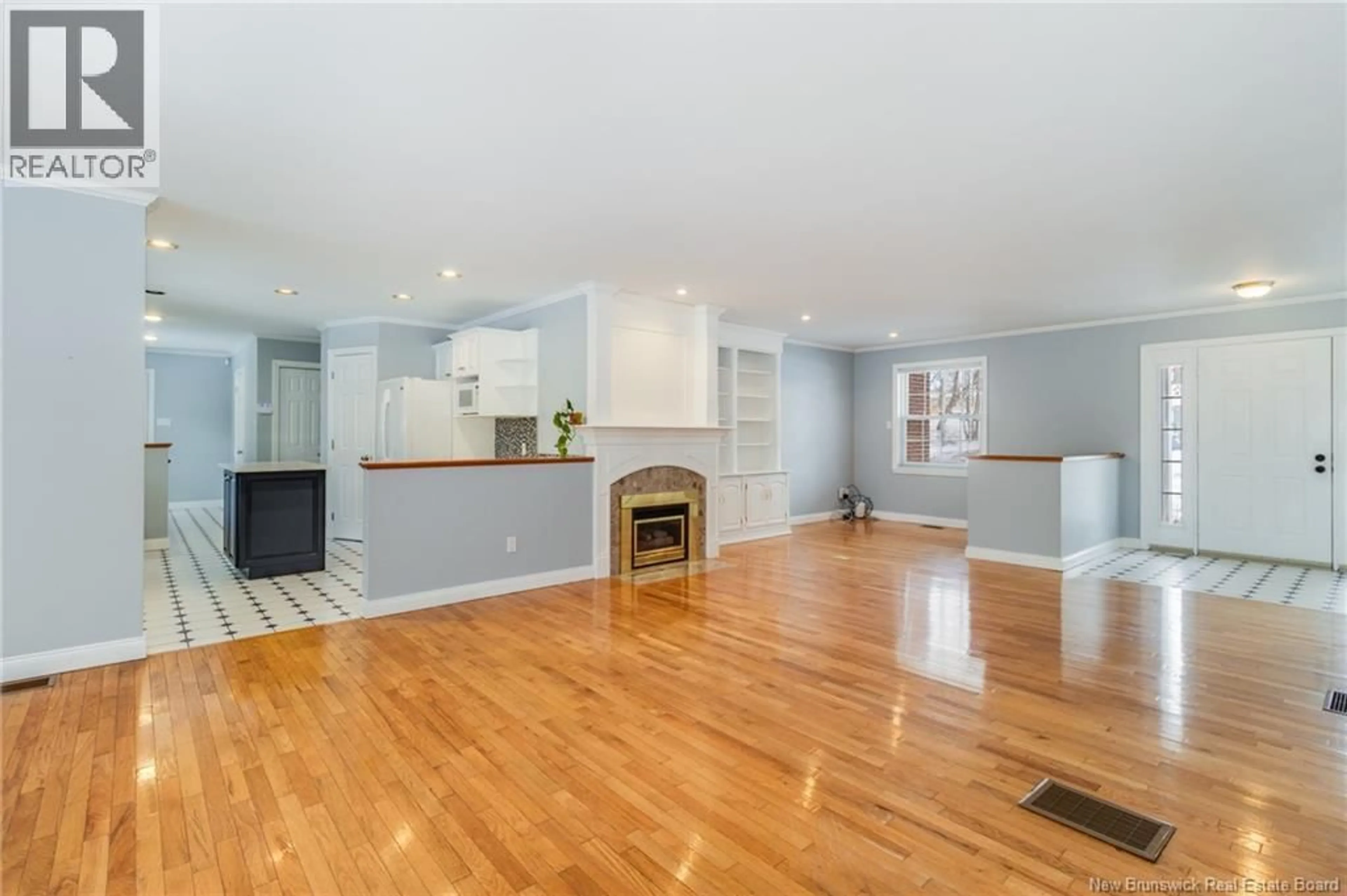 Open concept kitchen, wood/laminate floor for 22 LEXINGTON LANE, Fredericton New Brunswick E3A5S6