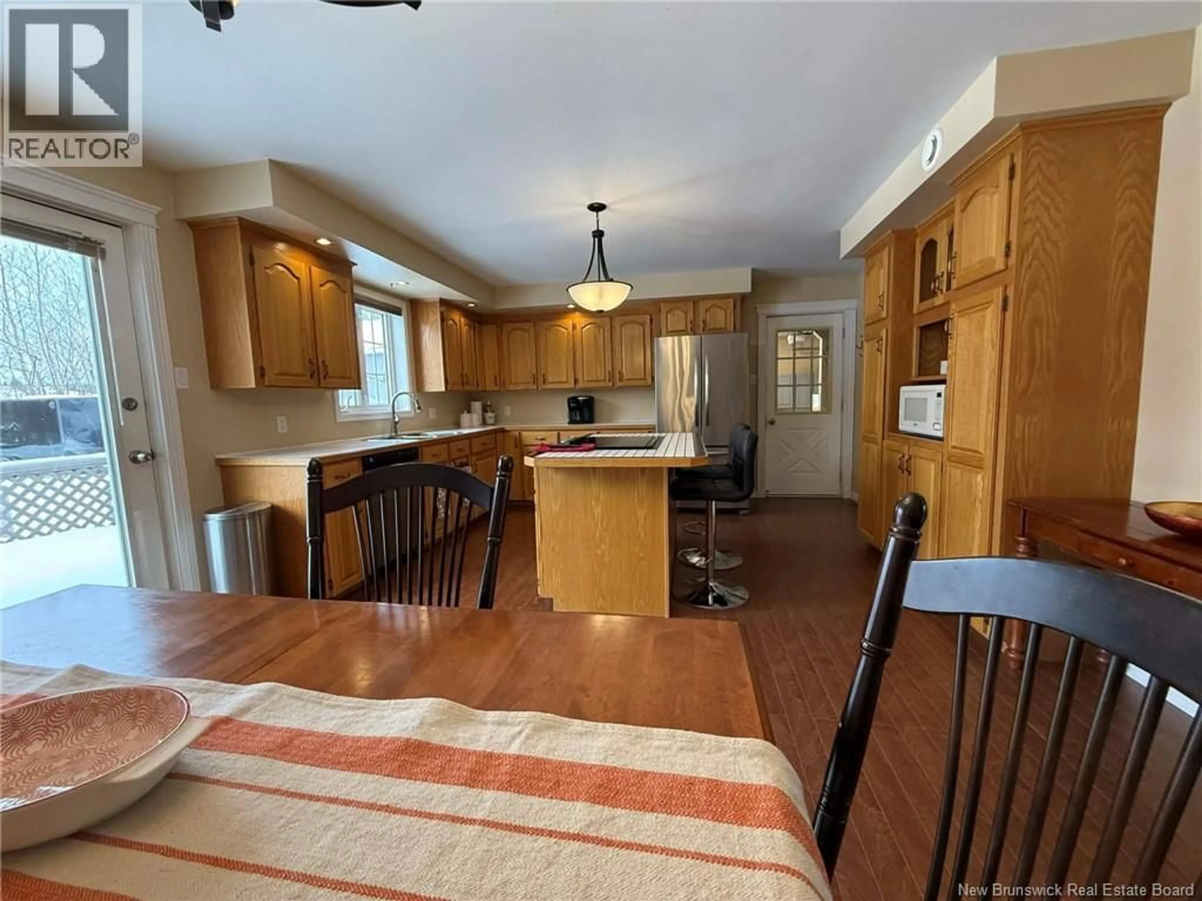 Open concept kitchen, wood/laminate floor for 10501 105 ROUTE, Upper Kent New Brunswick E7J2B5