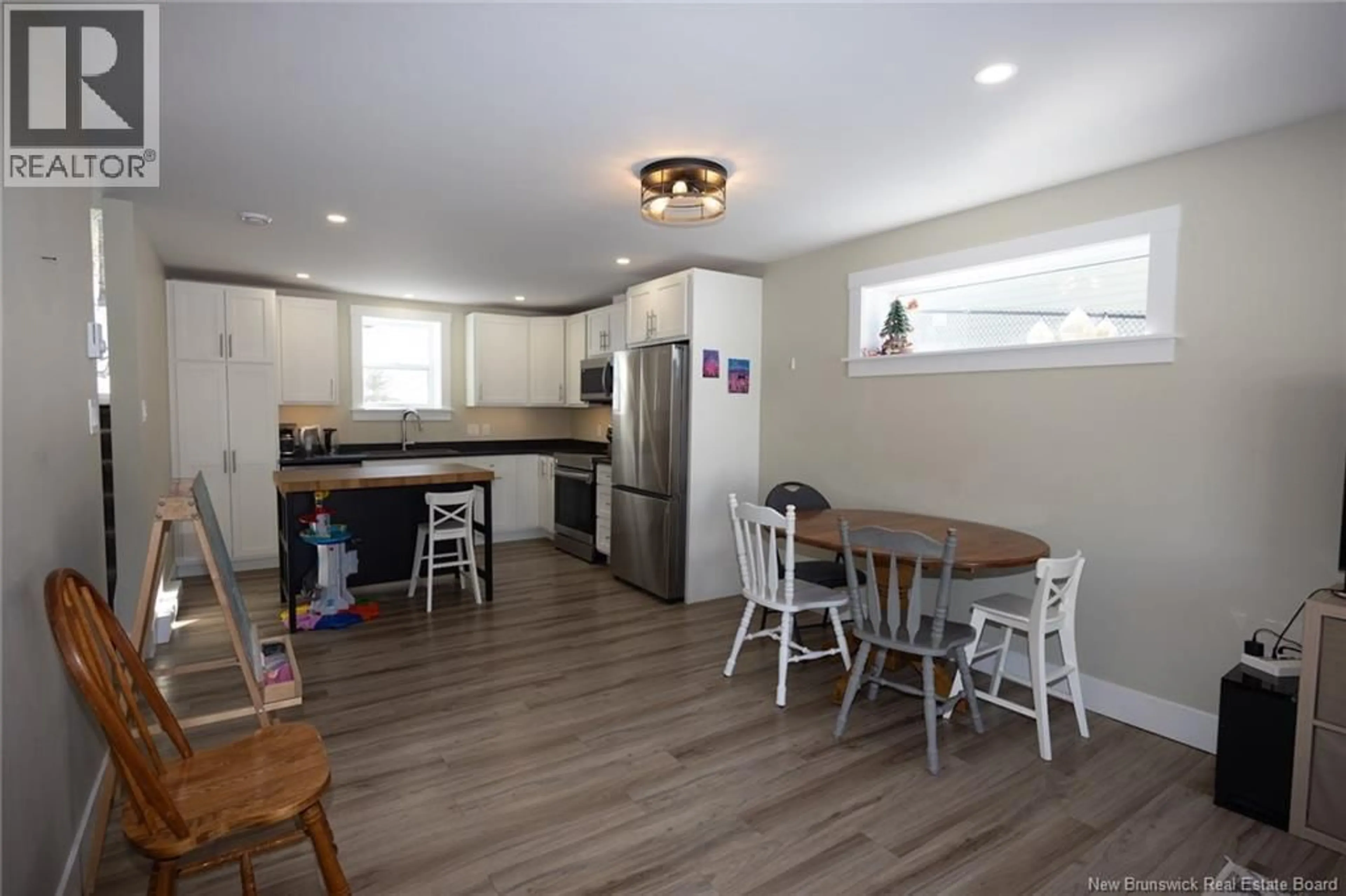 Open concept kitchen, wood/laminate floor for 67 DEWITT ACRES, Fredericton New Brunswick E3A6S3