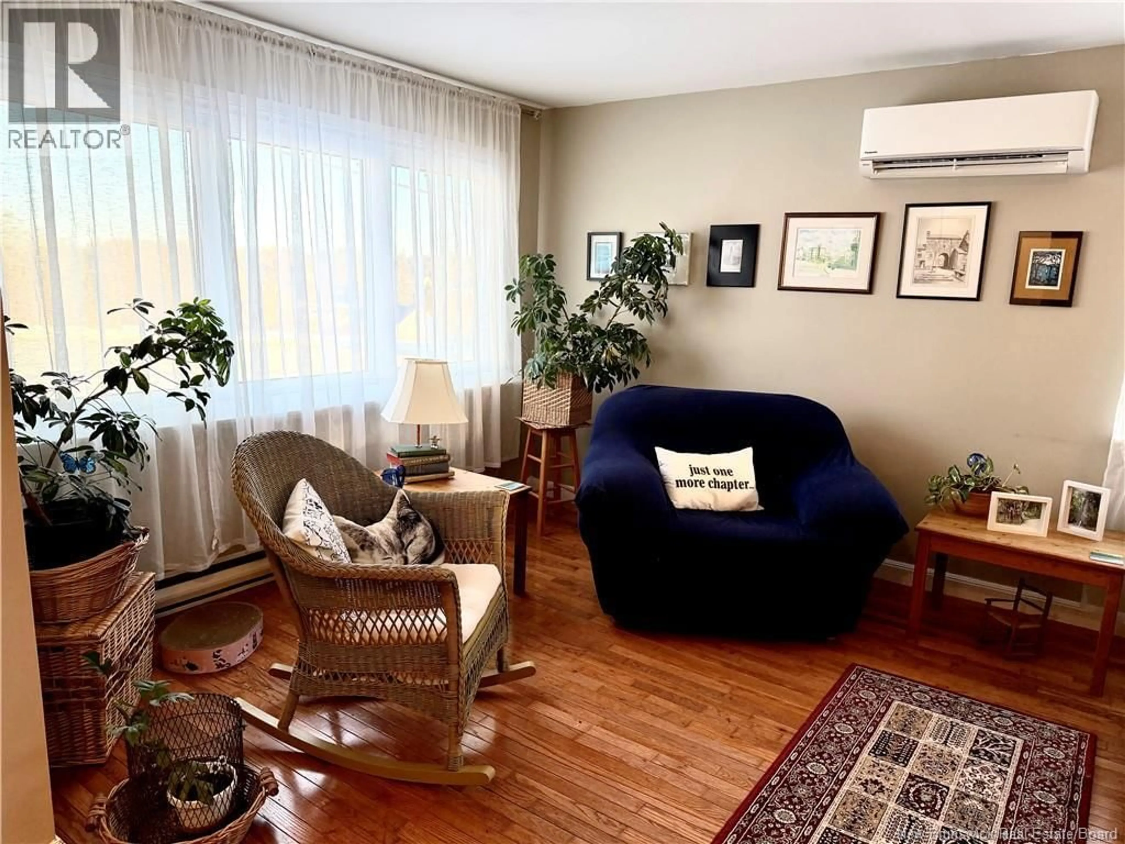 Living room with furniture, wood/laminate floor for 1472 LORNEVILLE ROAD, Saint John New Brunswick E2M7H6