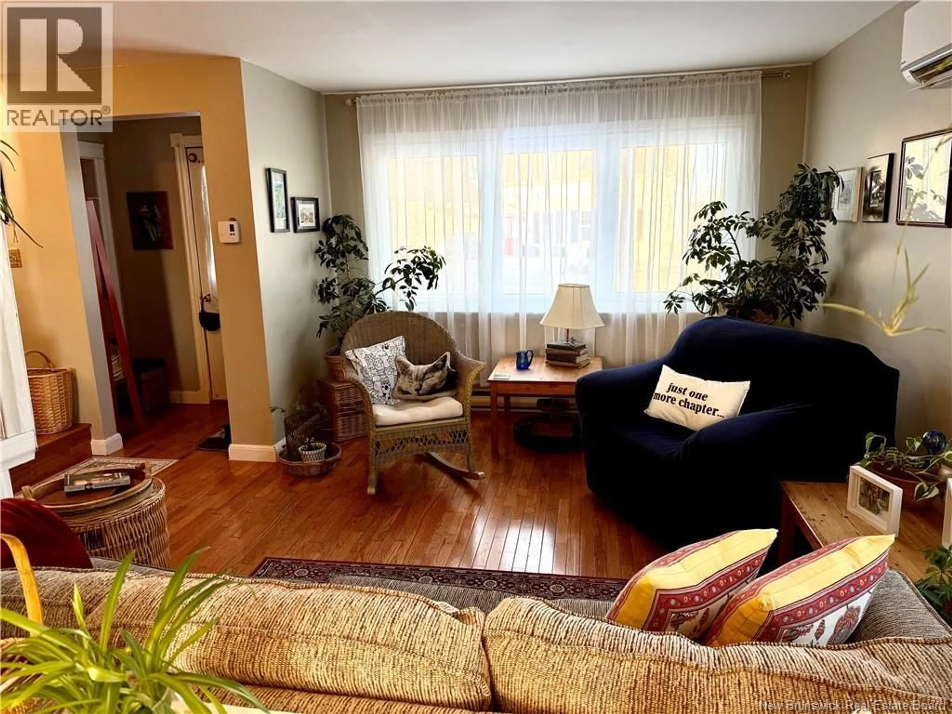Living room with furniture, wood/laminate floor for 1472 LORNEVILLE ROAD, Saint John New Brunswick E2M7H6