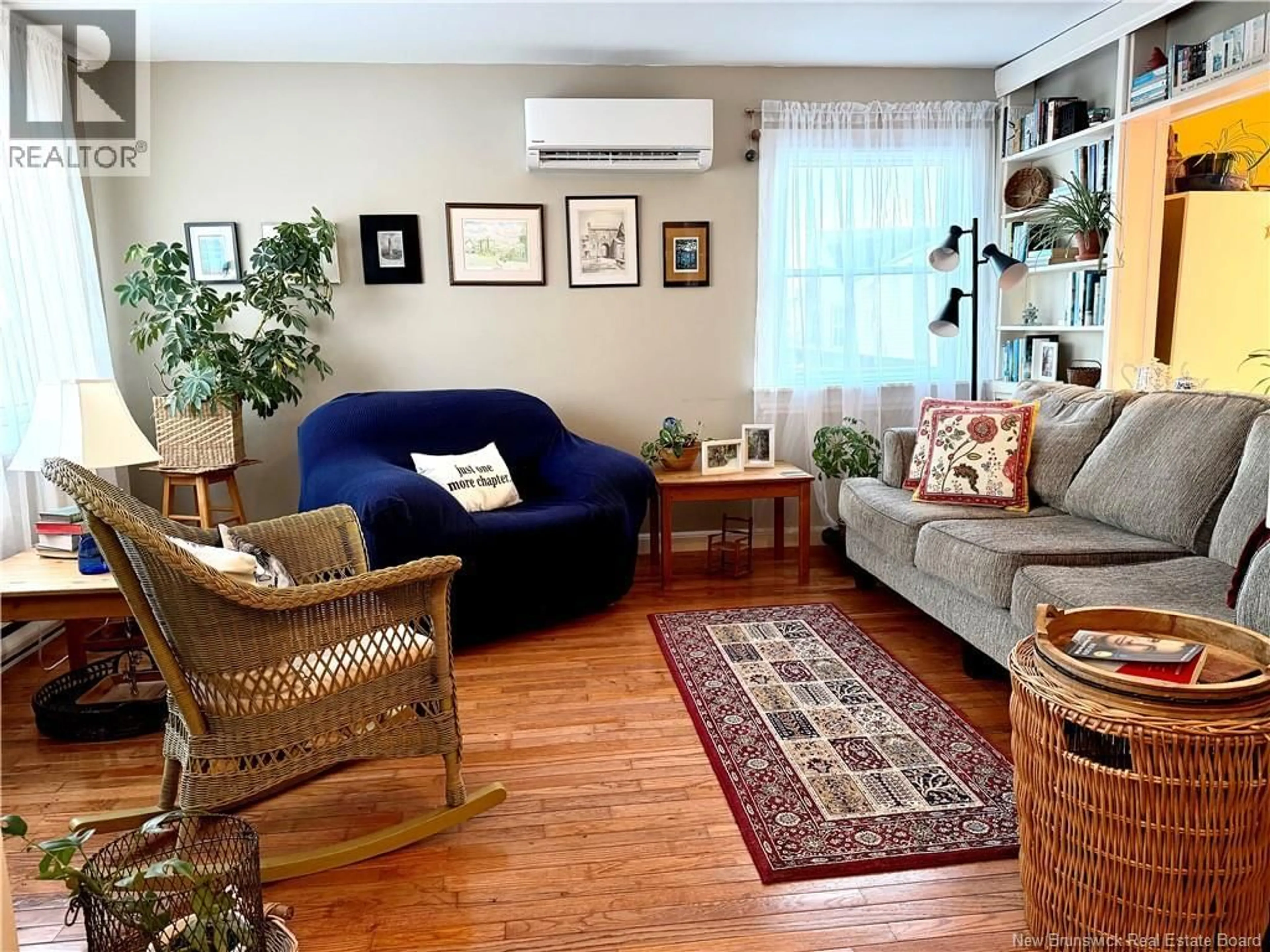 Living room with furniture, wood/laminate floor for 1472 LORNEVILLE ROAD, Saint John New Brunswick E2M7H6