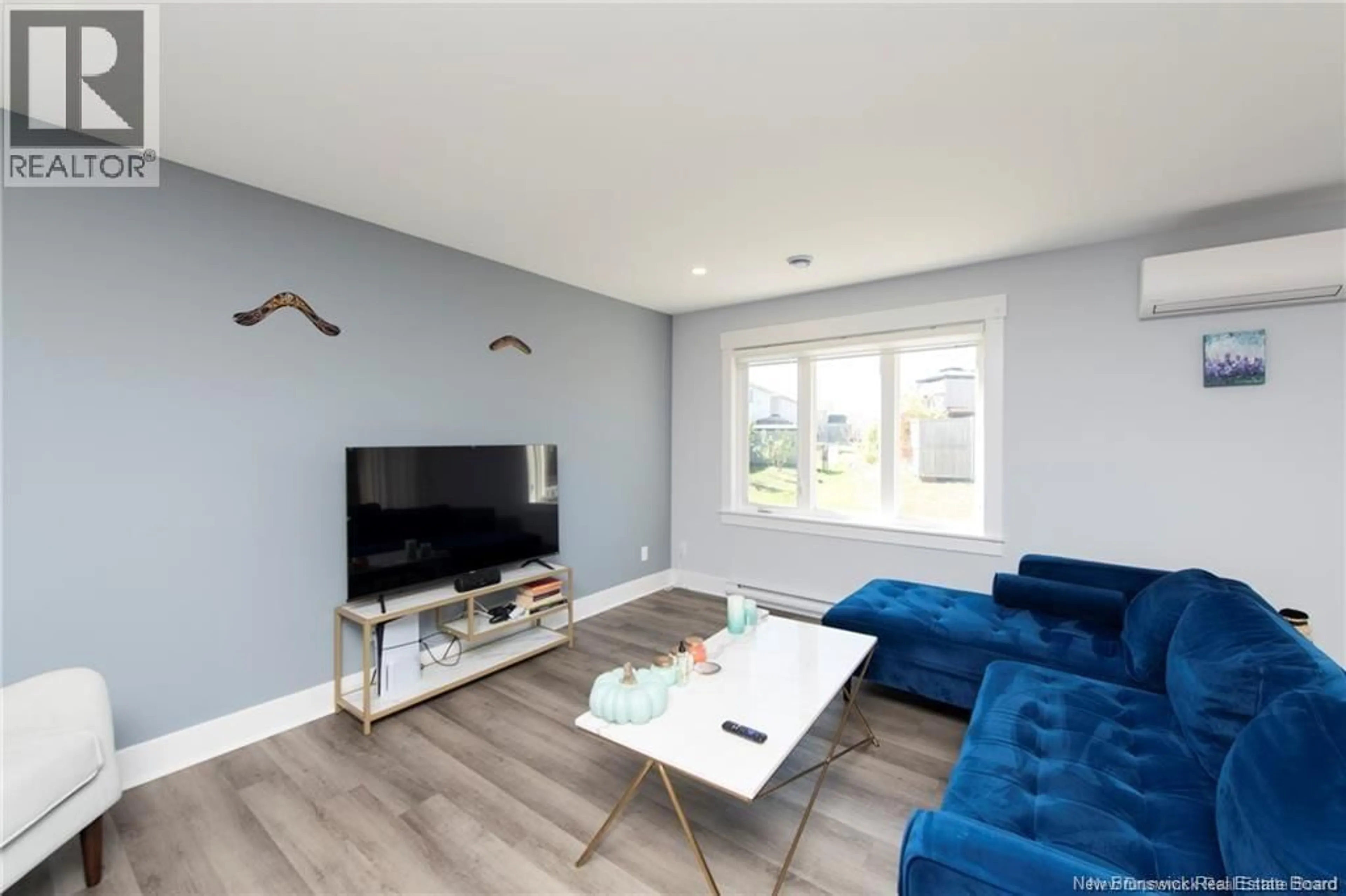 Living room with furniture, wood/laminate floor for 24 SATLEVILLE CRESCENT, Riverview New Brunswick E1B0W2