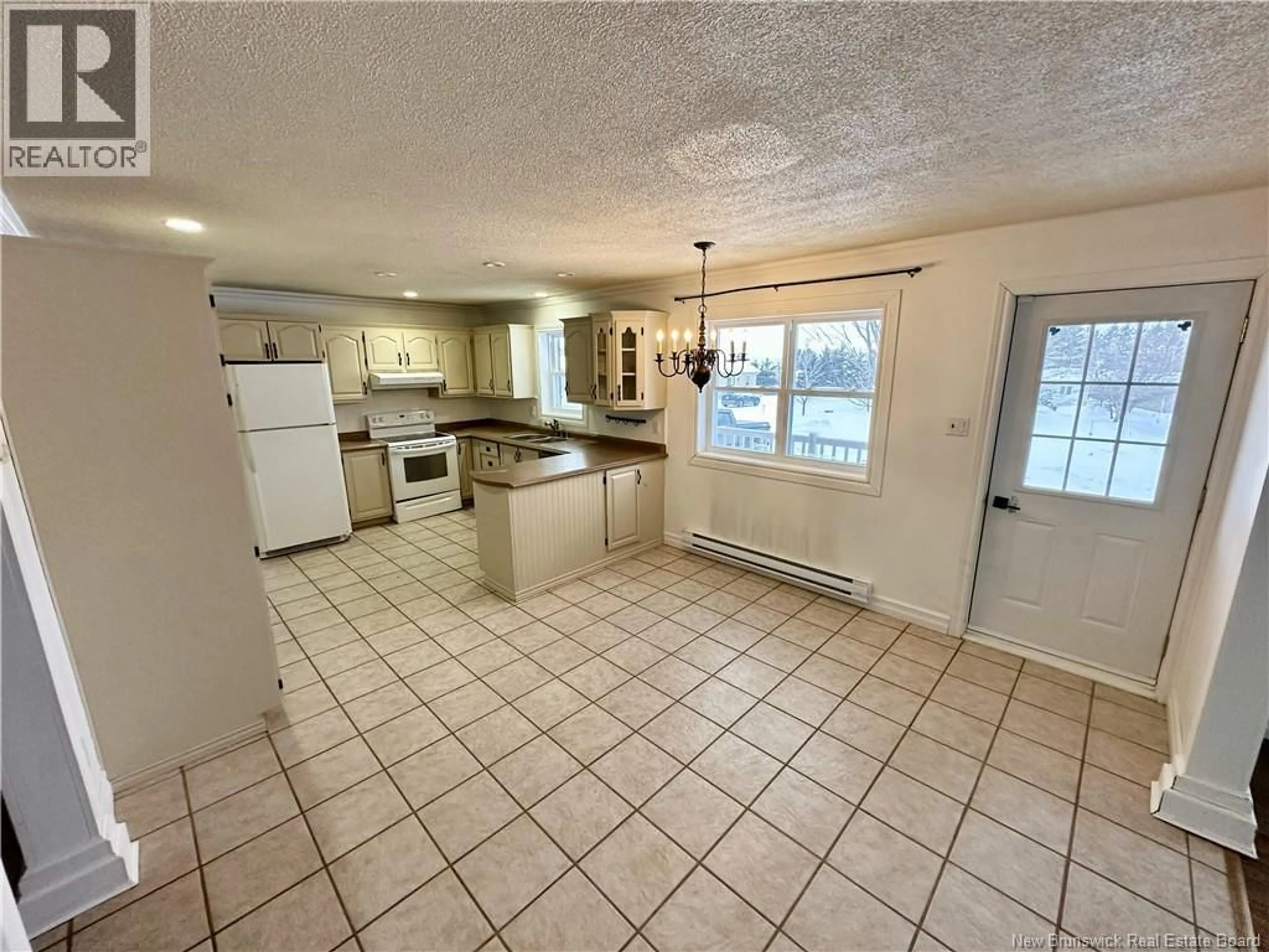 Open concept kitchen, ceramic/tile floor for 11 FRANCOIS STREET, Charlo New Brunswick E8E2J8